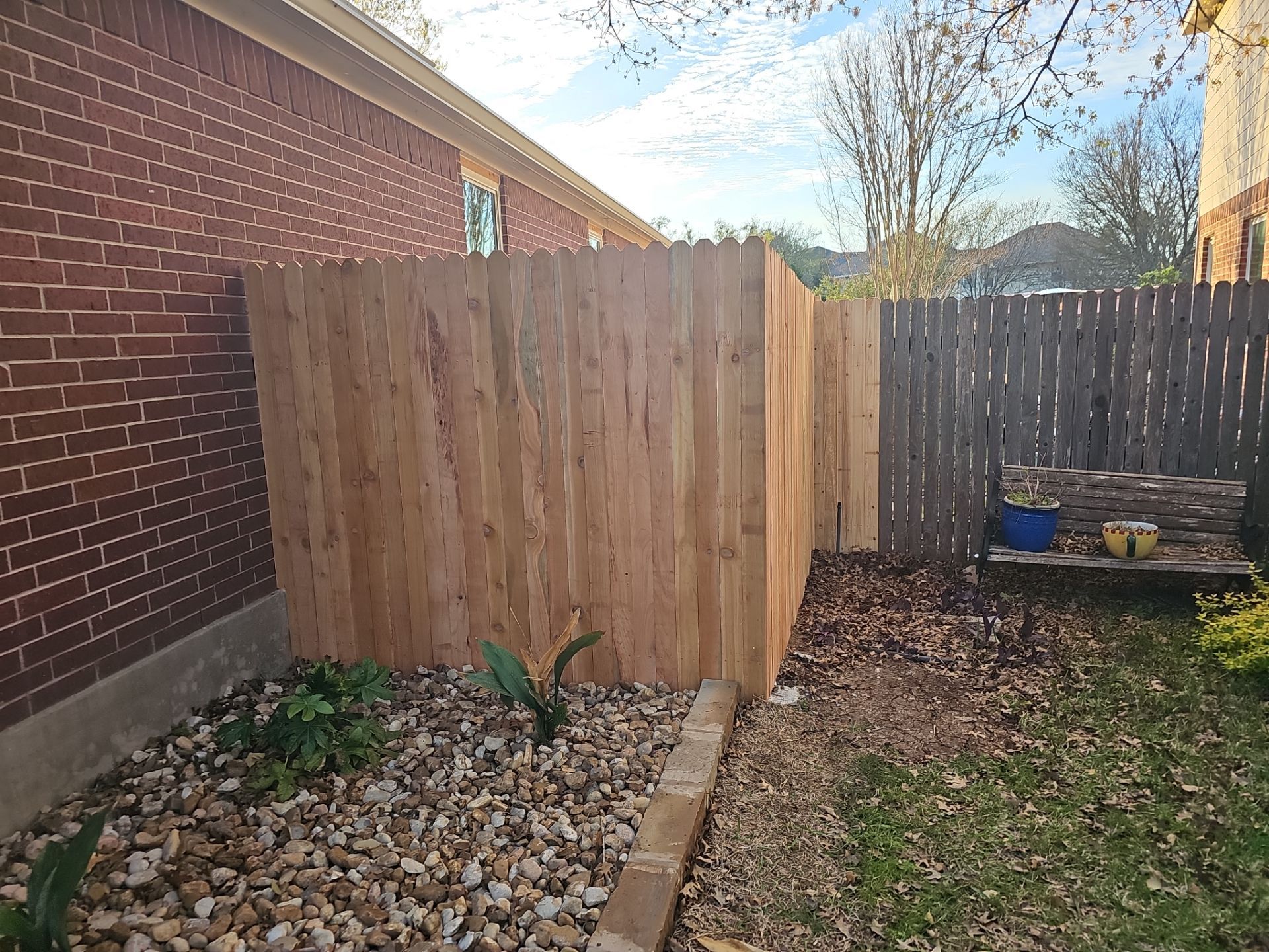 Fence Installation using Cedar Pickets by DeZign Roofing & Exteriors