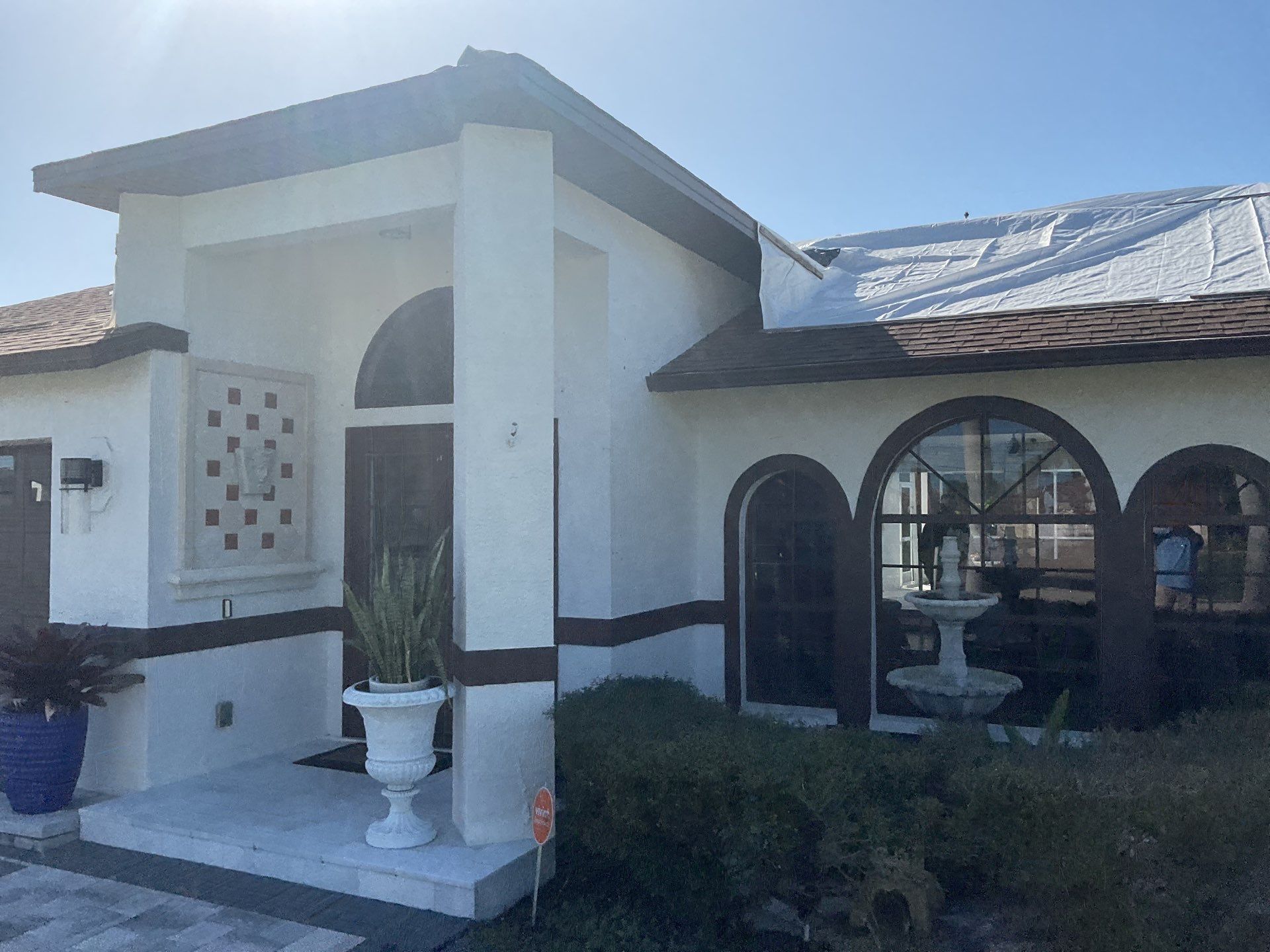 Brown Gutter + White and Brown Downspouts in Cape Coral FL by Gutter Professors