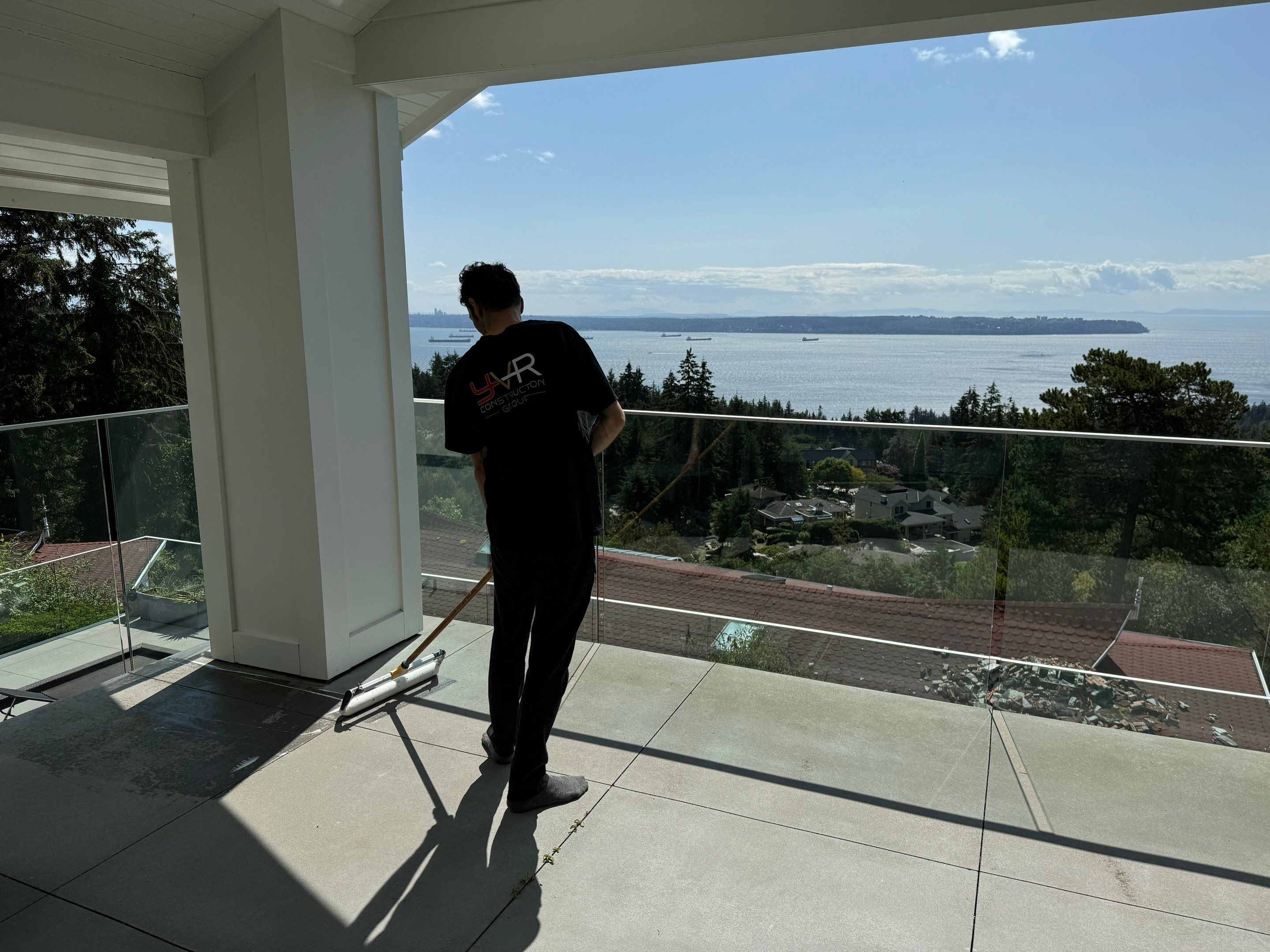 Applying Concrete Sealer  by YVR Construction Group