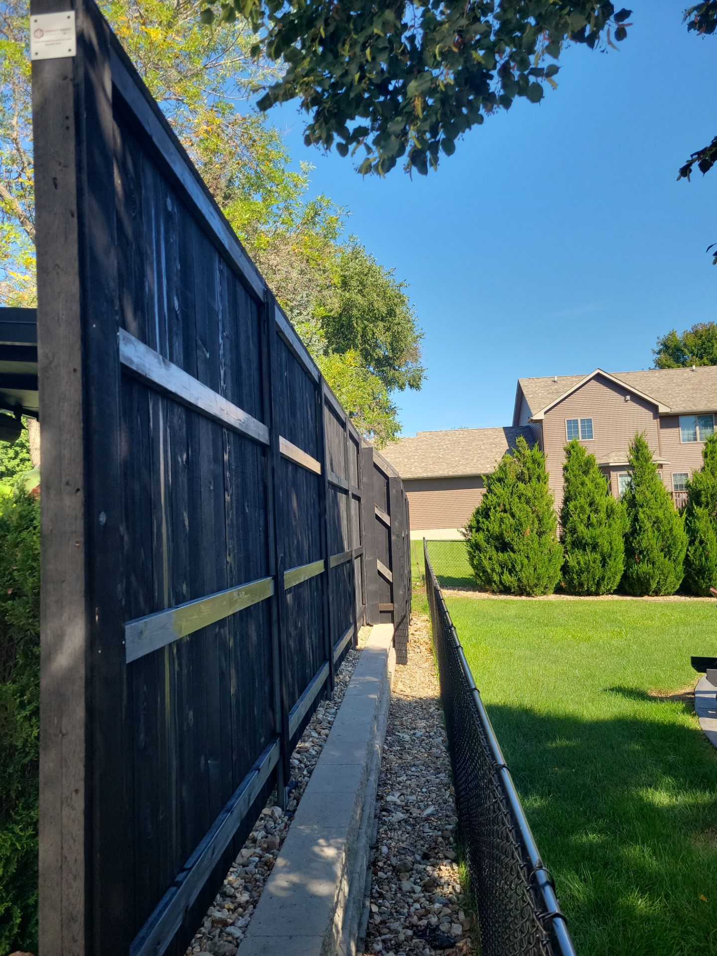 Black Wood Privacy Fence in Cedar Falls by Perfect Picket Fence and Stain