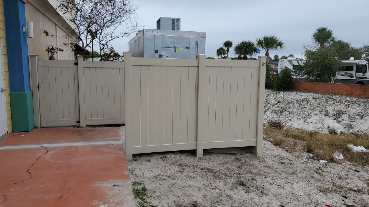 Commercial using Tan 6' Vinyl by Hip Square Fence Inc.