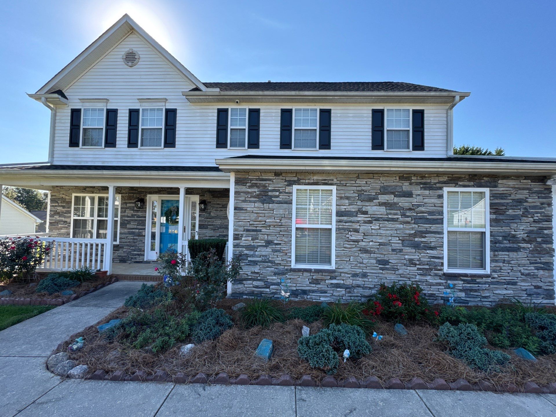 cleaning of the stone facade and siding with pressure washing for enhanced appearance and maintenance of the surfaces