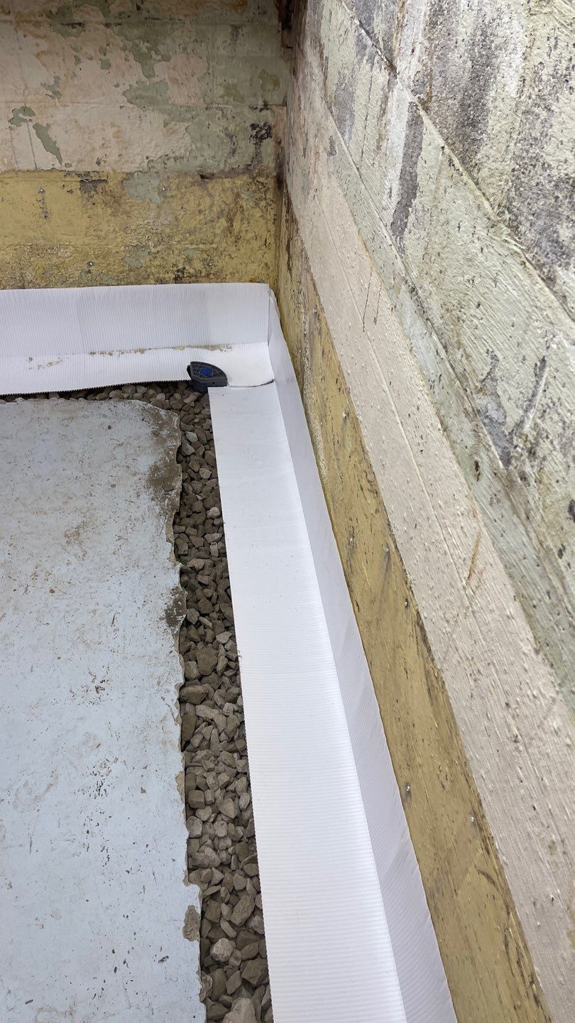 Interior Waterproofing Using GrateDrain™ Products by Toledo Basement Repair 
