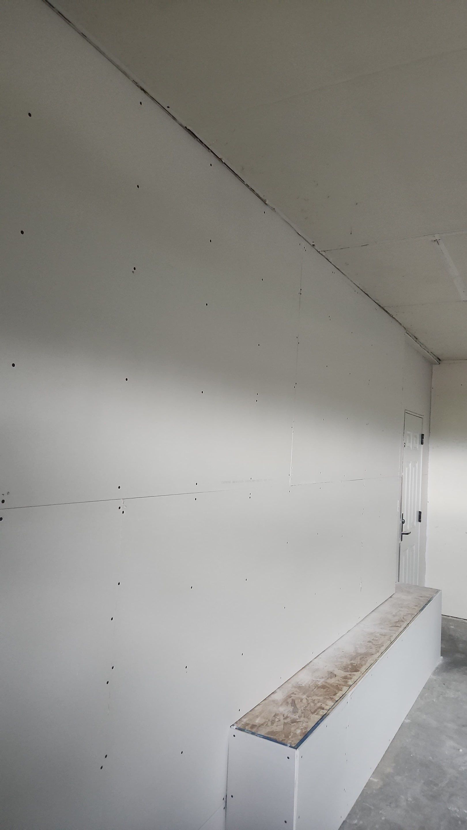 Yankton Garage Remodel with Andersen Window Installation and Drywall by Select Painting, Coatings & Garage Cabinets