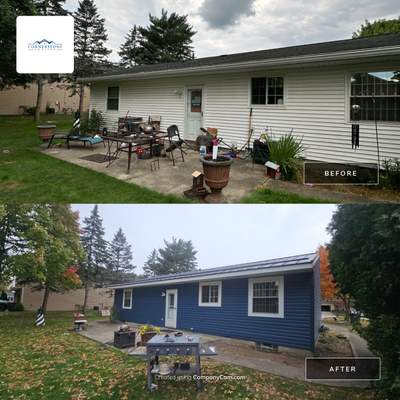 Wadsworth Exterior Transformation Featuring Blue Vertical Siding and Metal Roofing