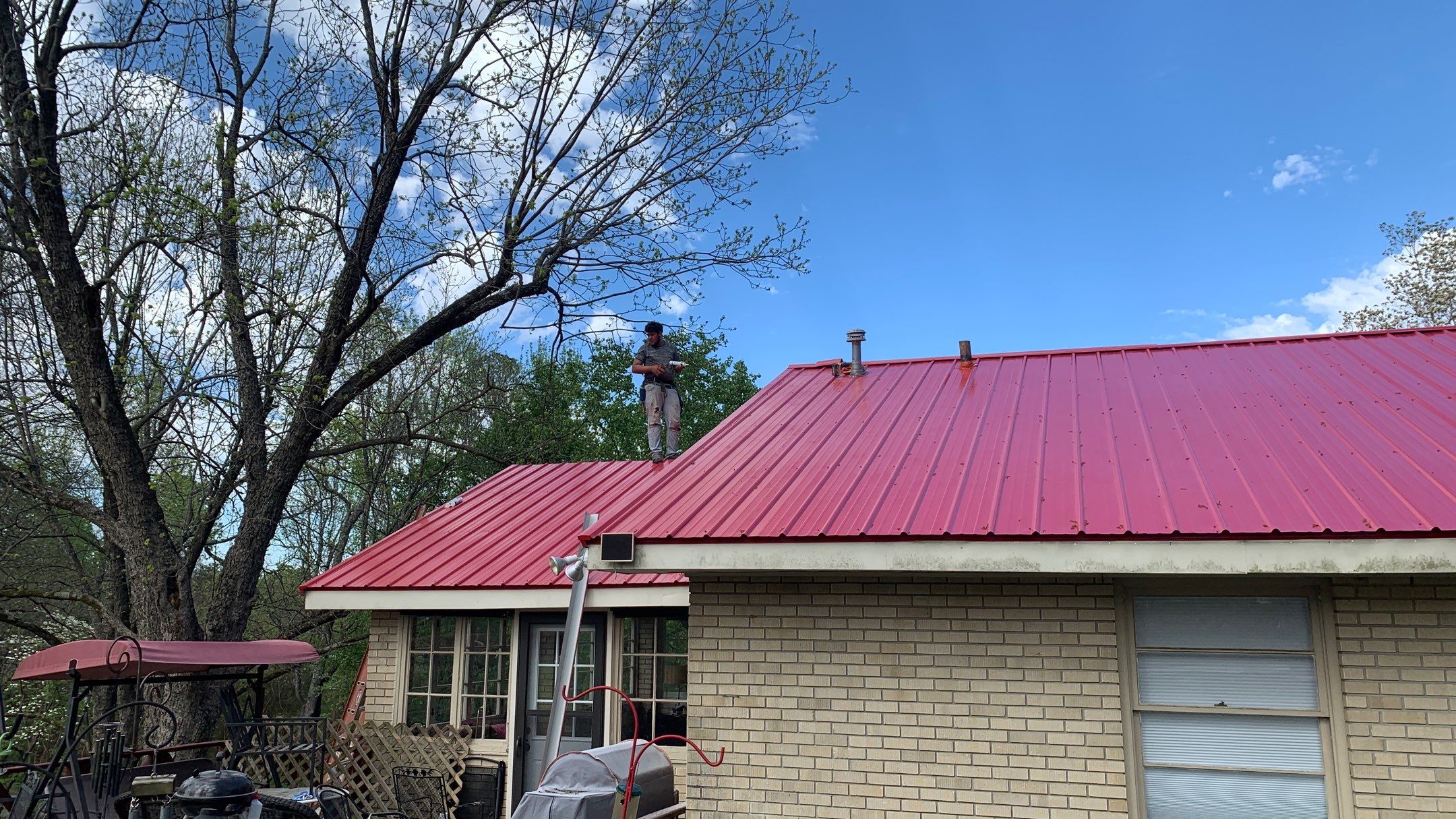 Residential Roofing Installation using 26 Gauge Colored Panels by Hostetler Roofing