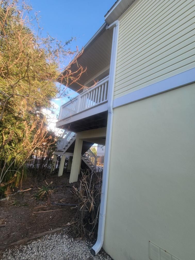 White Gutters with Matching Downspouts in Sarasota FL by Gutter Professors