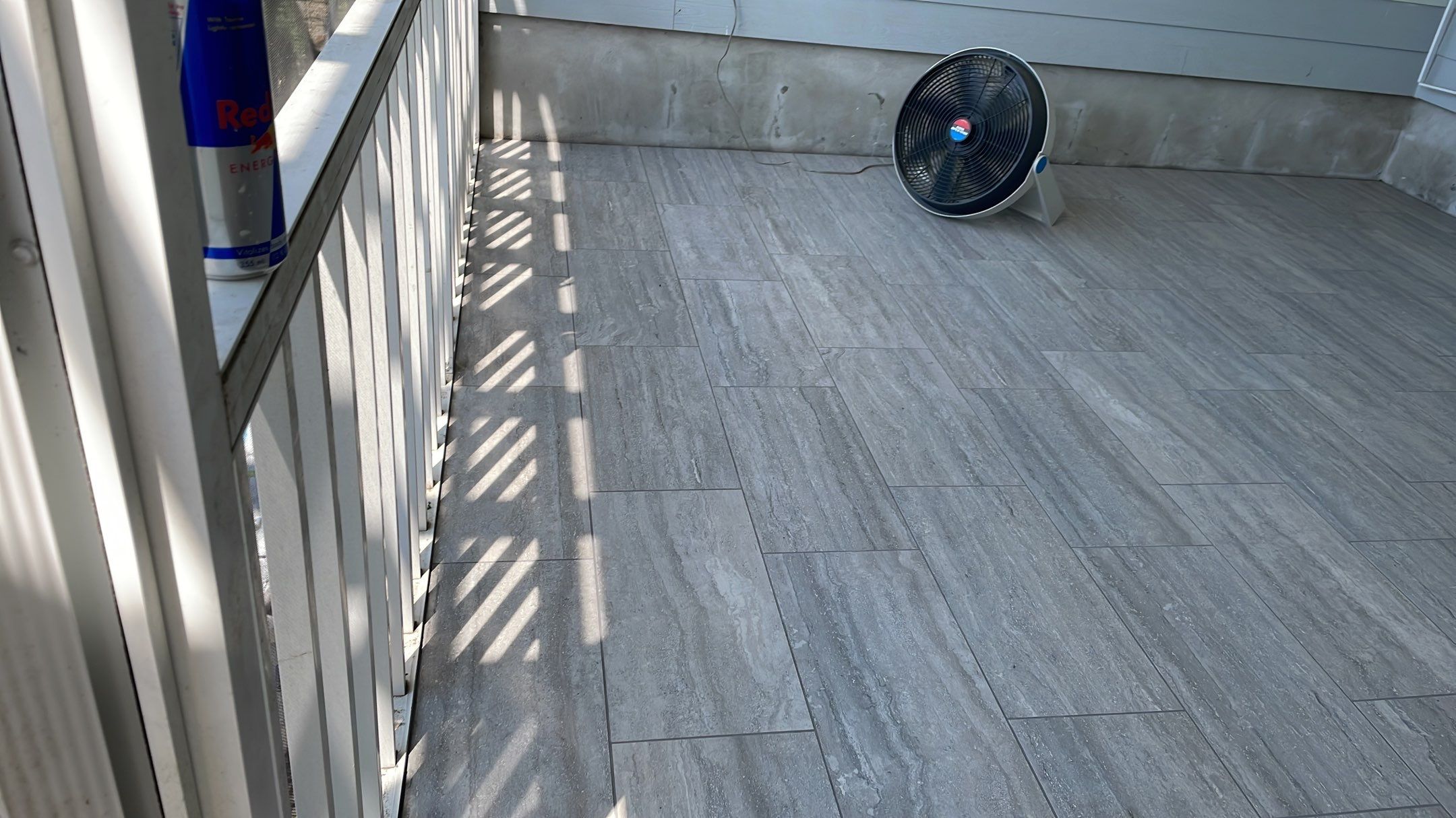 Sunroom using 12x24 tiles by Footprints Floors of Coastal Carolina