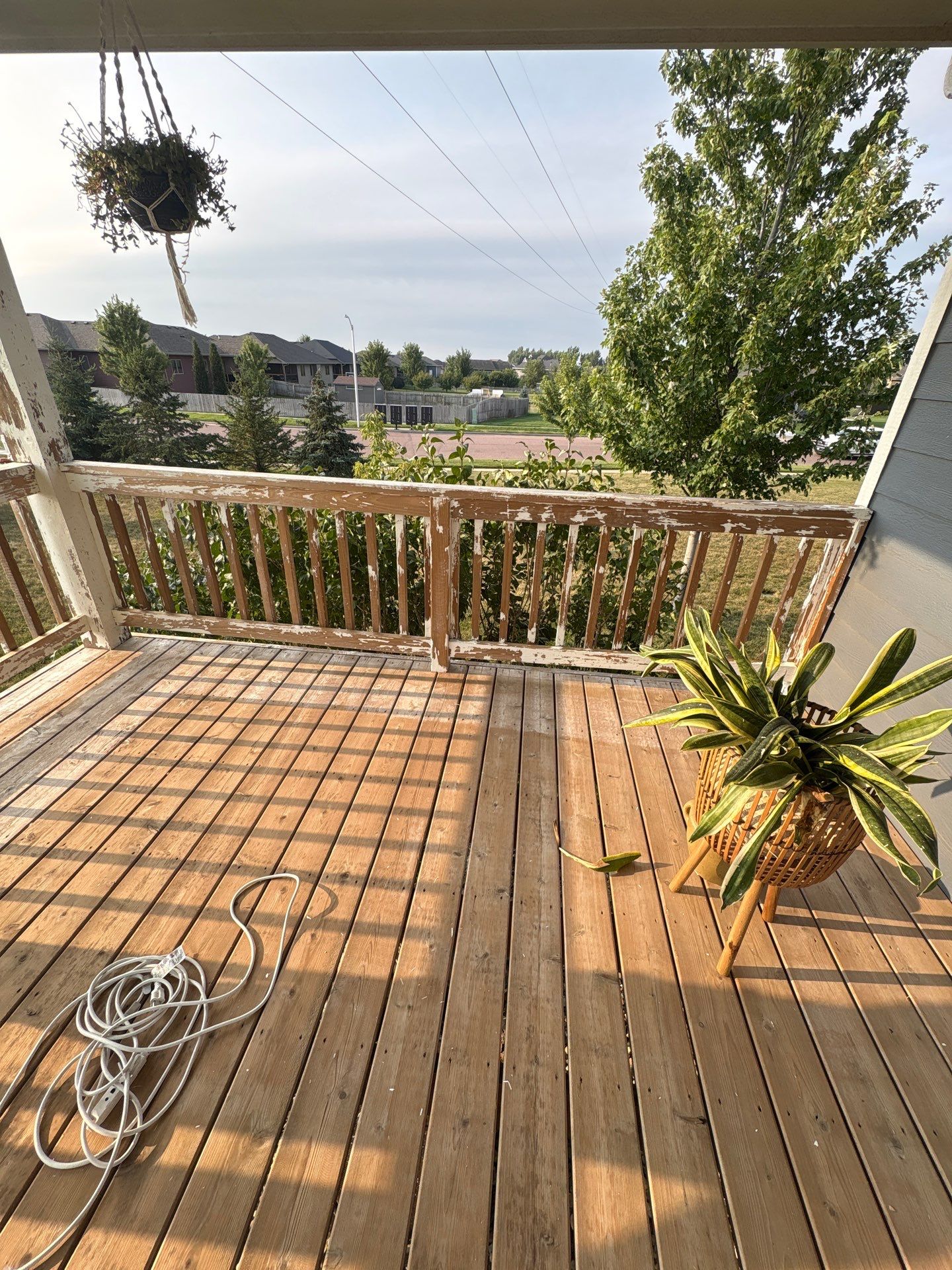 Sioux Falls Exterior Residential Siding and Deck Painting Project by Select Painting, Coatings & Garage Cabinets
