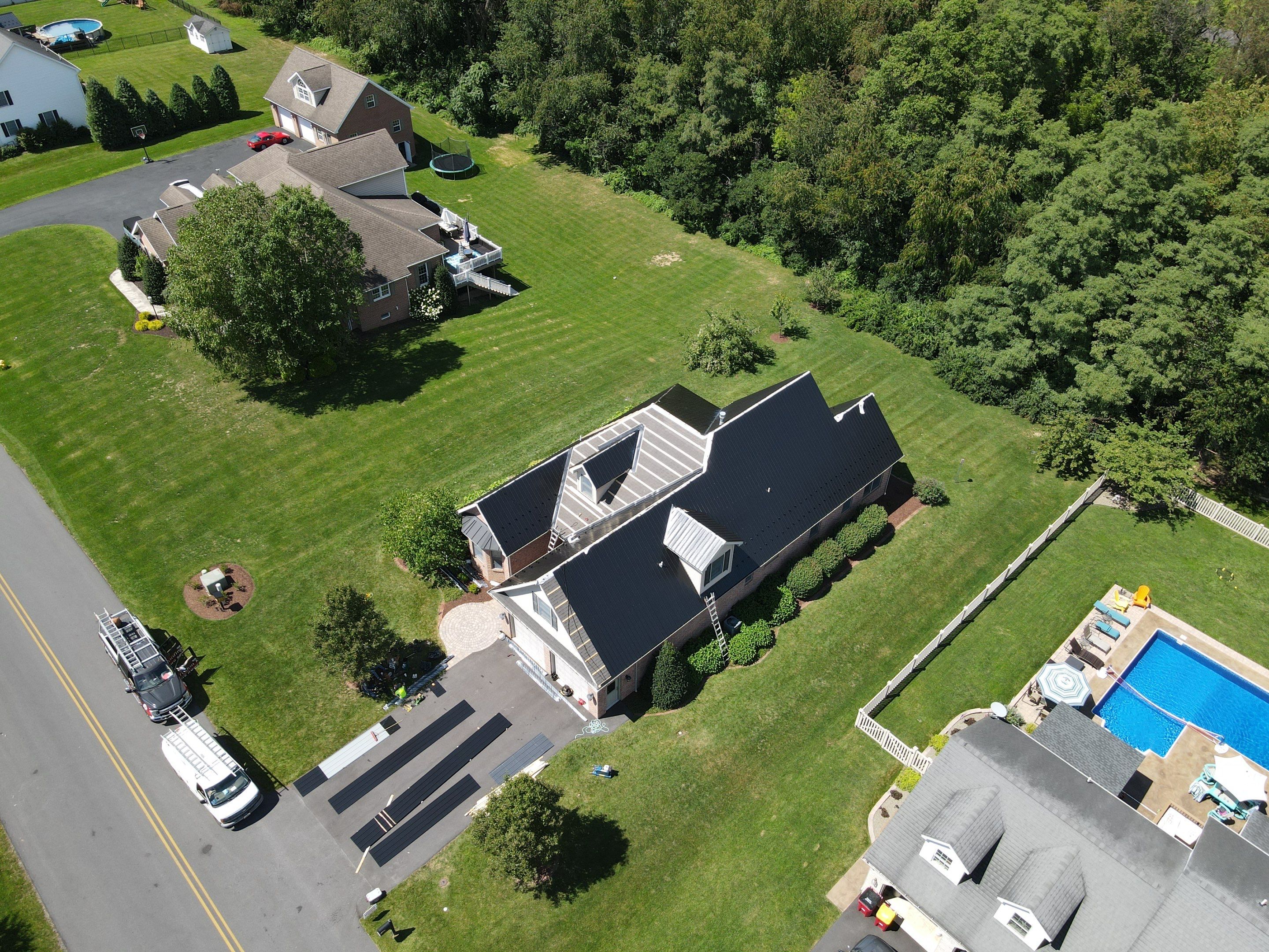 Standing seam / Azm panel in black  by Teflon Roofing