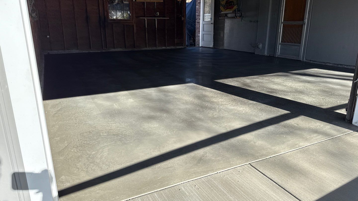 Concrete garage floor replacement with a broom finished apron and sidewalk  by NG Masonry & Construction LLC