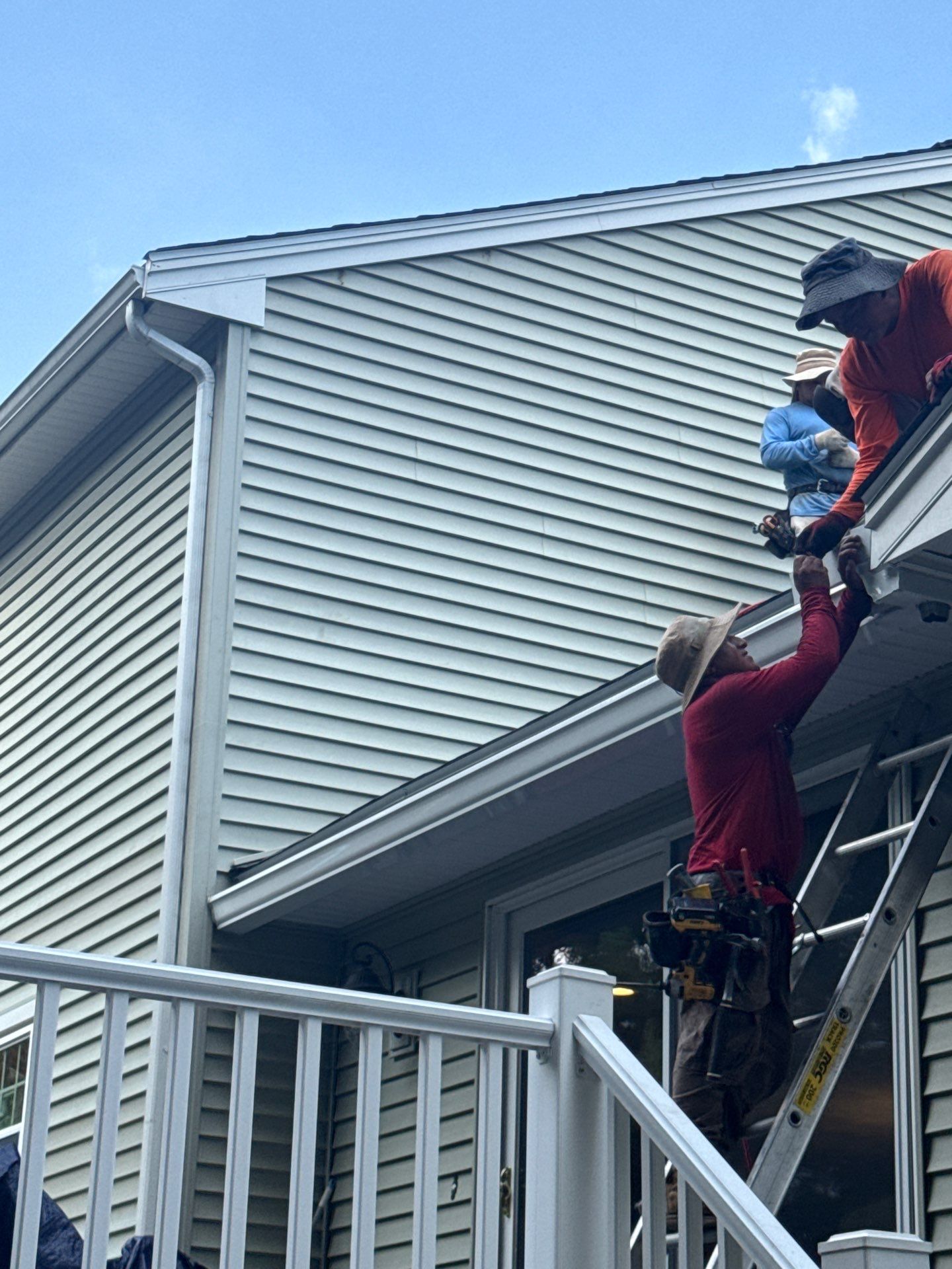 Complete Roof Replacement with Chimney Flashing, Gutter Guard System, and Vinyl Siding Repairs by Mighty Dog Roofing of Greater Middlesex County