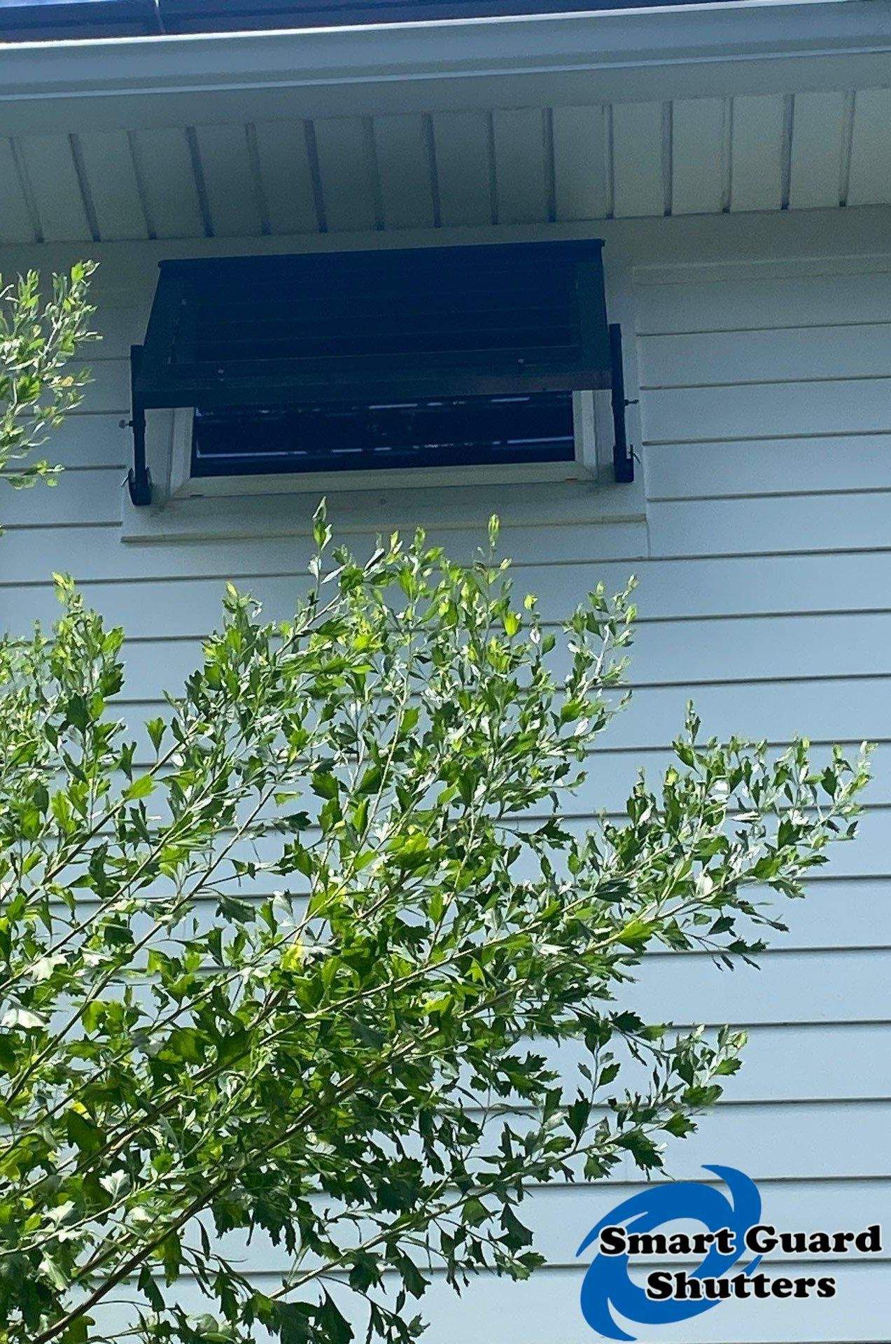 Impact Bahama Shutters in Jet Black by Smart Guard Shutters