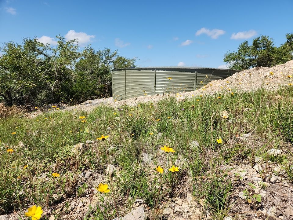 Residential Rainwater Collection System - Pioneer 40K gallon water tank in Mangrove Green by Hill Country Rain Water
