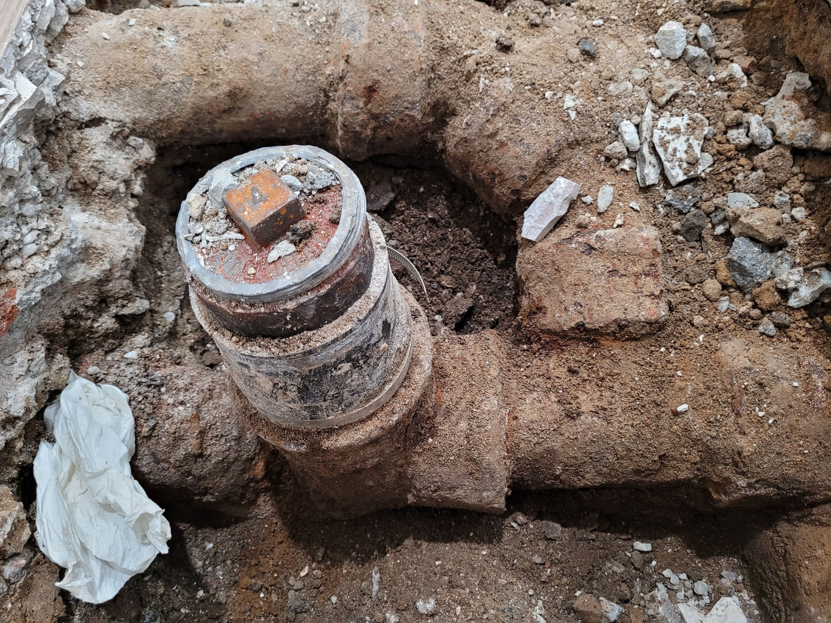 The replacement of a crumbing leaky house u-trap in basement by WG's Remodeling Inc