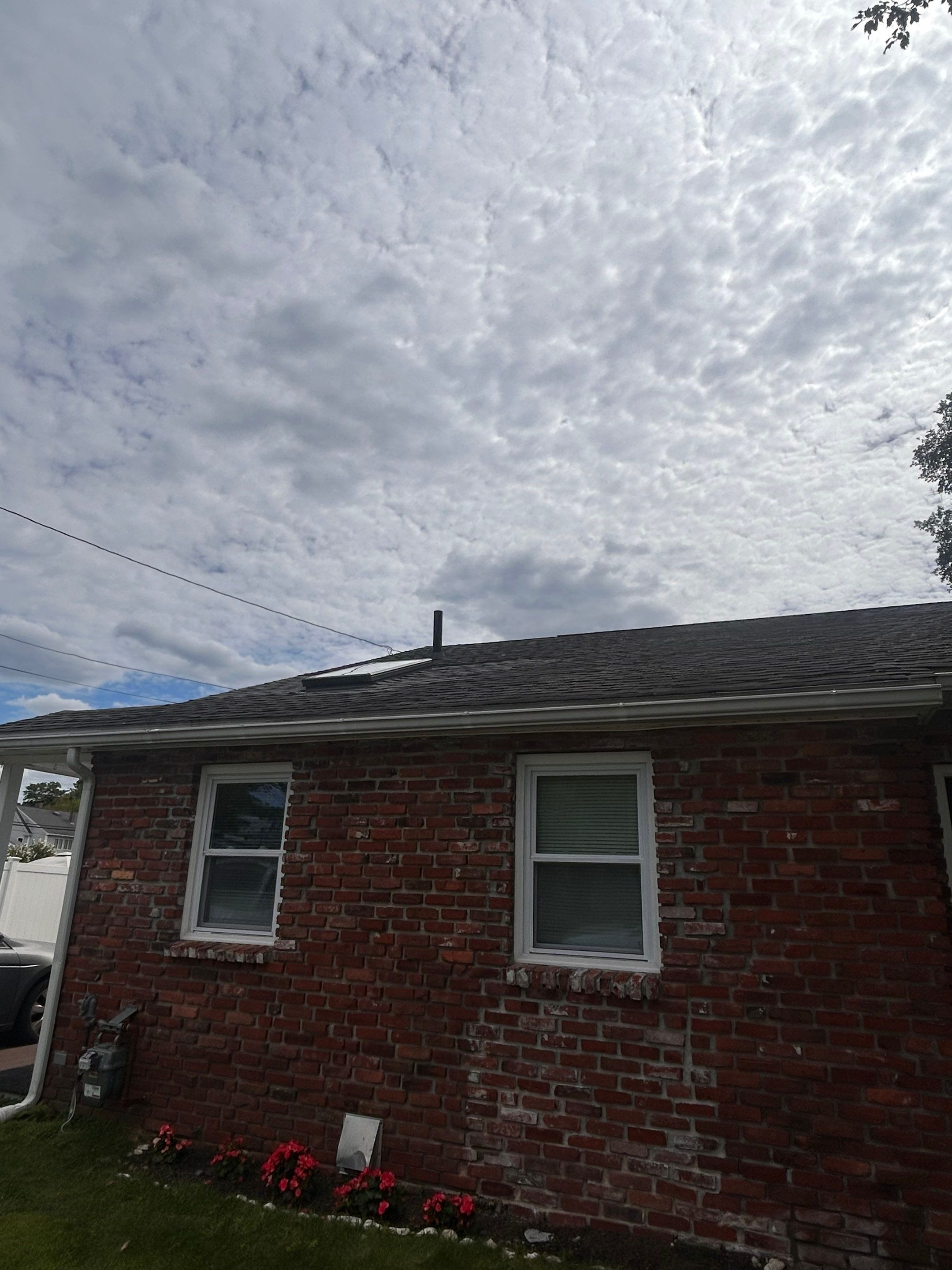 Lowell Premium Velux Curb-Mount Skylight & Chimney Restoration by Mighty Dog Roofing of Greater Middlesex County