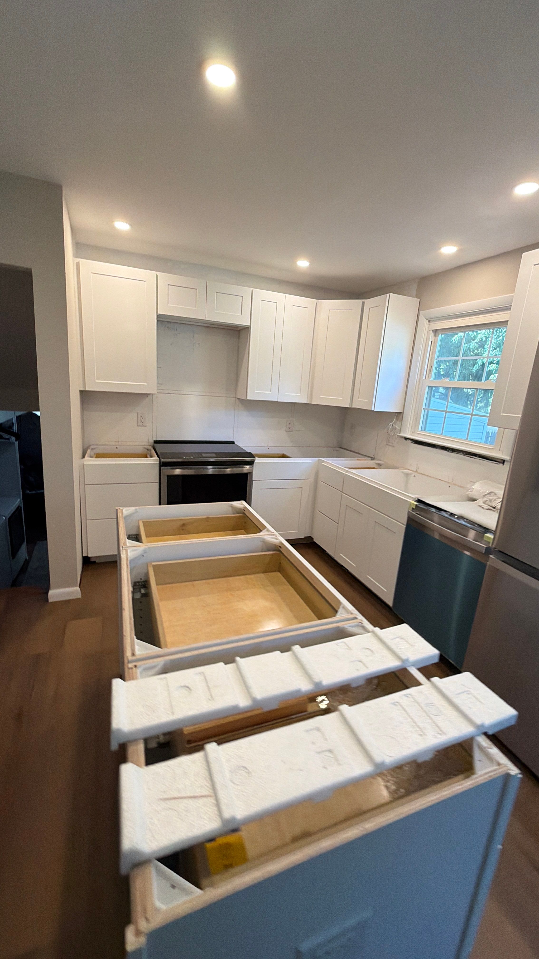 Phoenixville Kitchen Remodel with White Shaker Cabinets and Green Backsplash by Reliable General Contracting