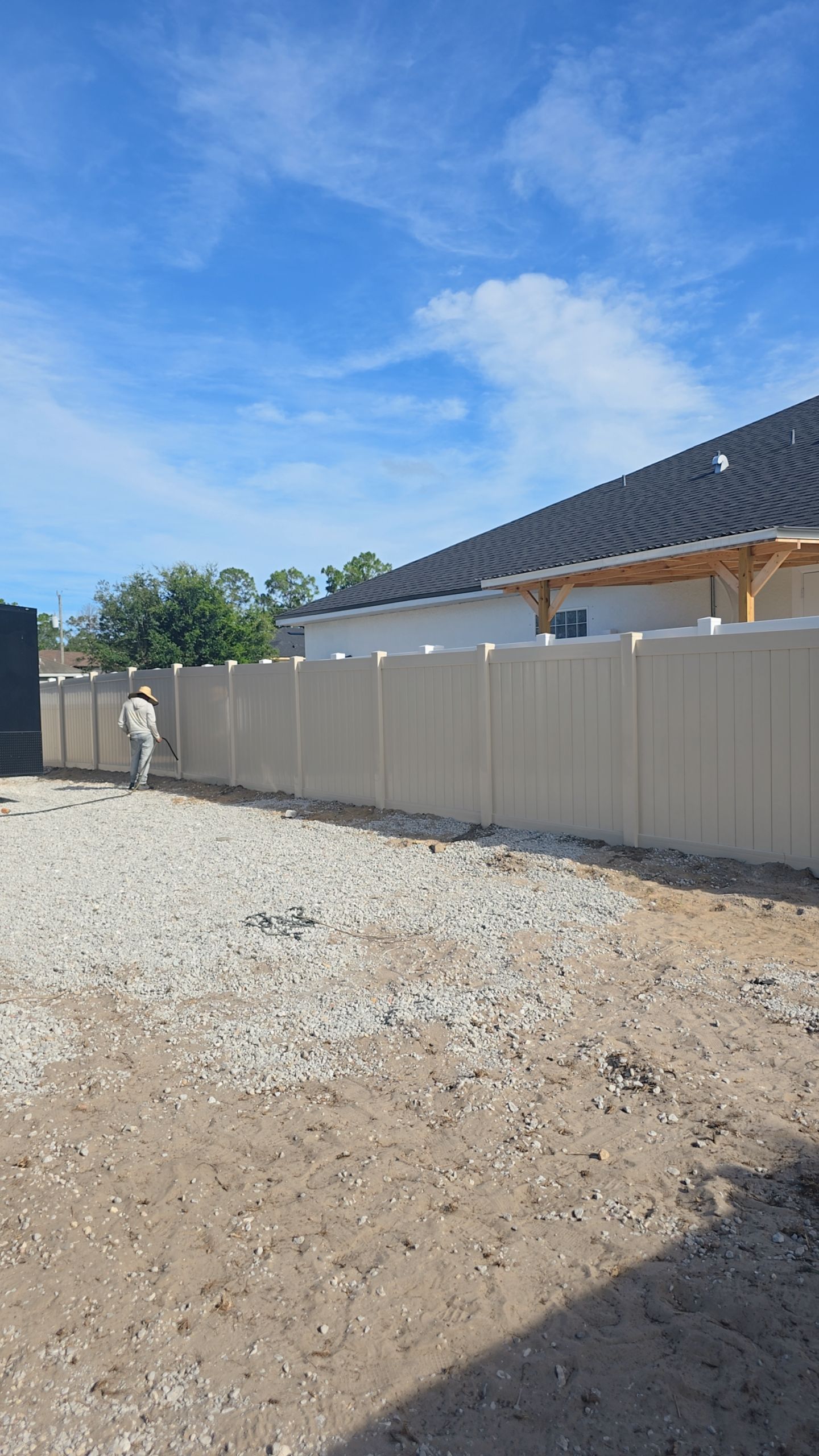 Tan Vinyl Privacy Fence and Gate Installation in North Port by True Fence LLC
