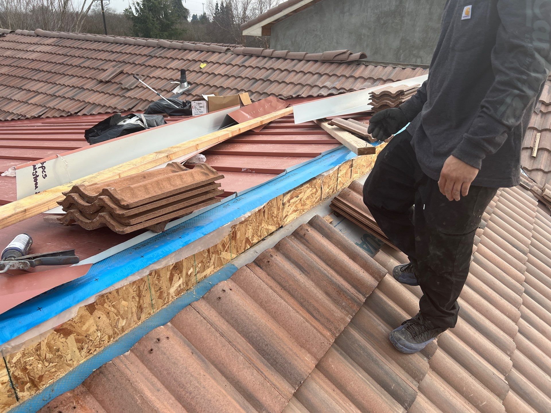 Tile, Metal, and TPO roofing project (new construction) by Straight Edge Roofing Inc