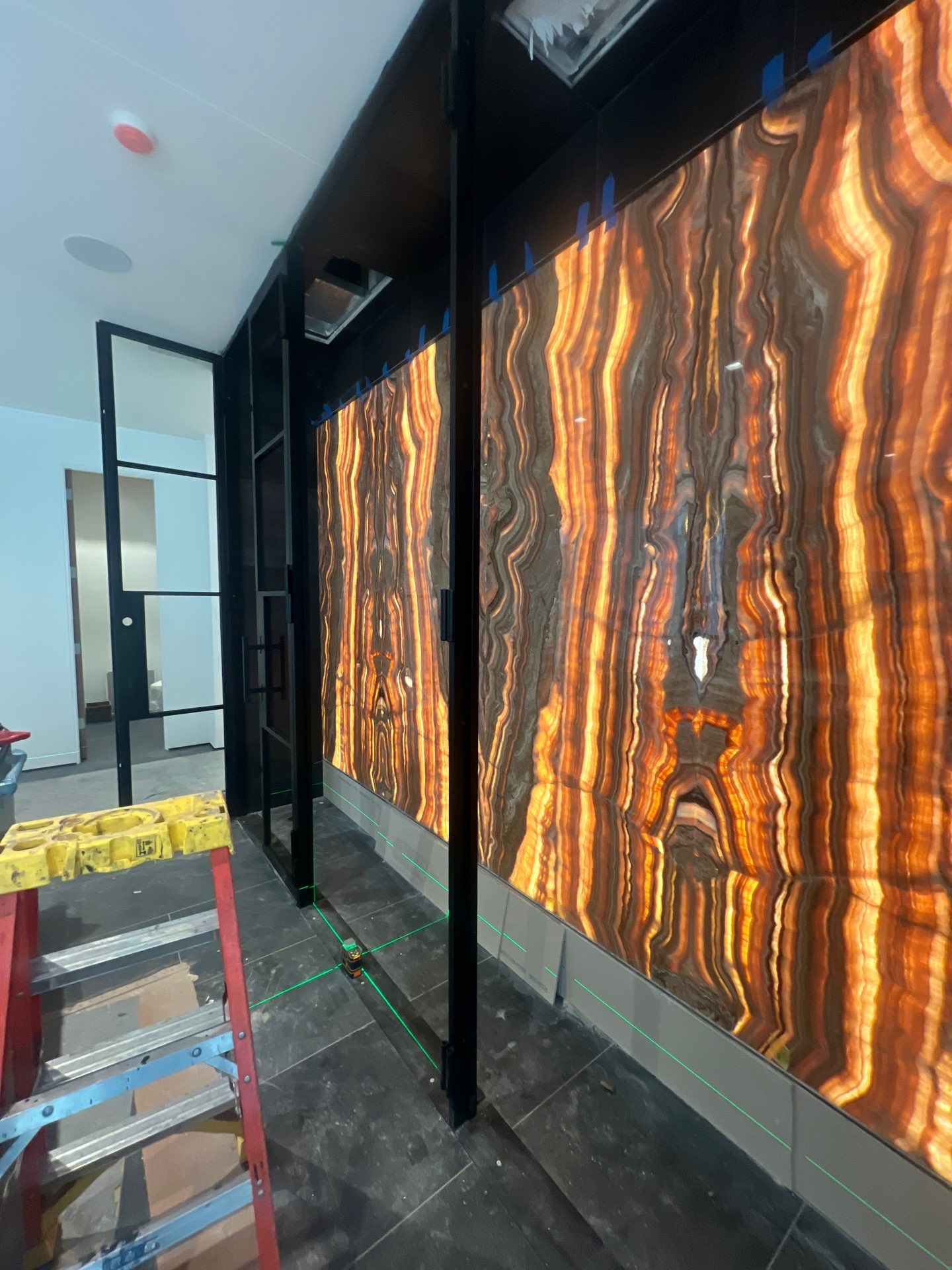Custom Black-Framed Glass Wine Cellar Installation in Dallas by Solara Custom Living