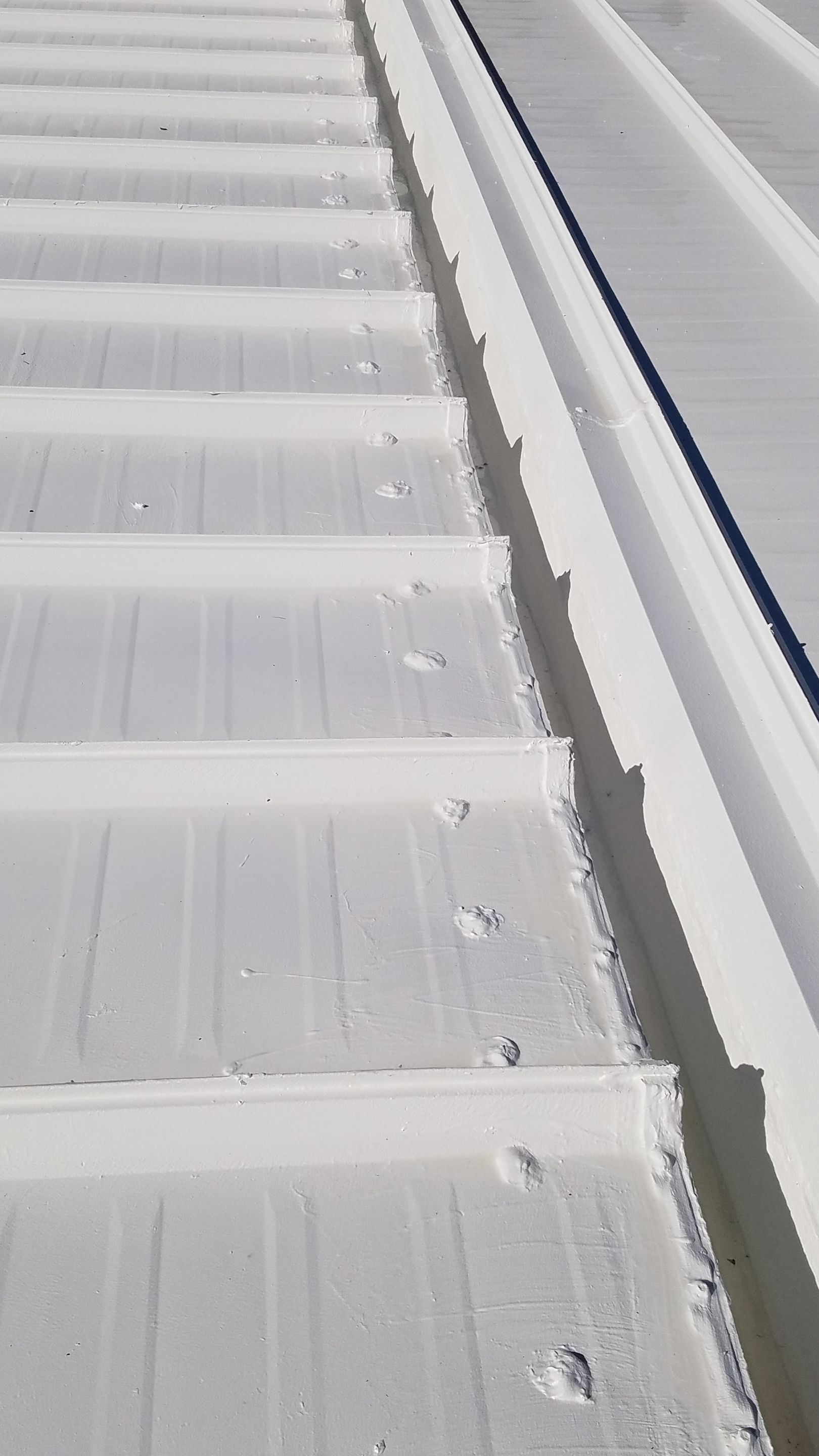 Commercial Metal Roof Coating by Gold Star Roofing LLC