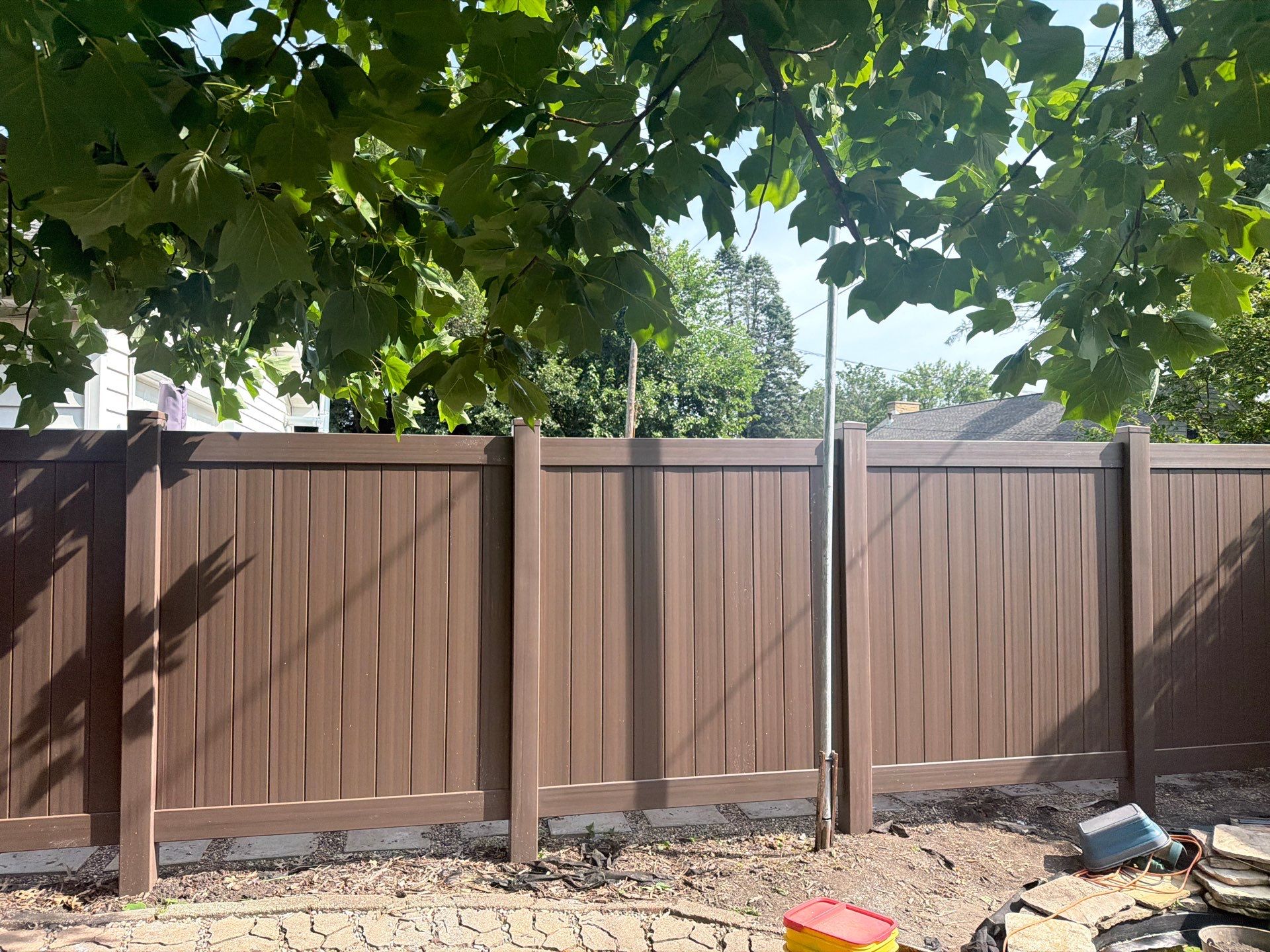 Walnut Vinyl Privacy Fence Installation in Waterloo by Perfect Picket Fence and Stain