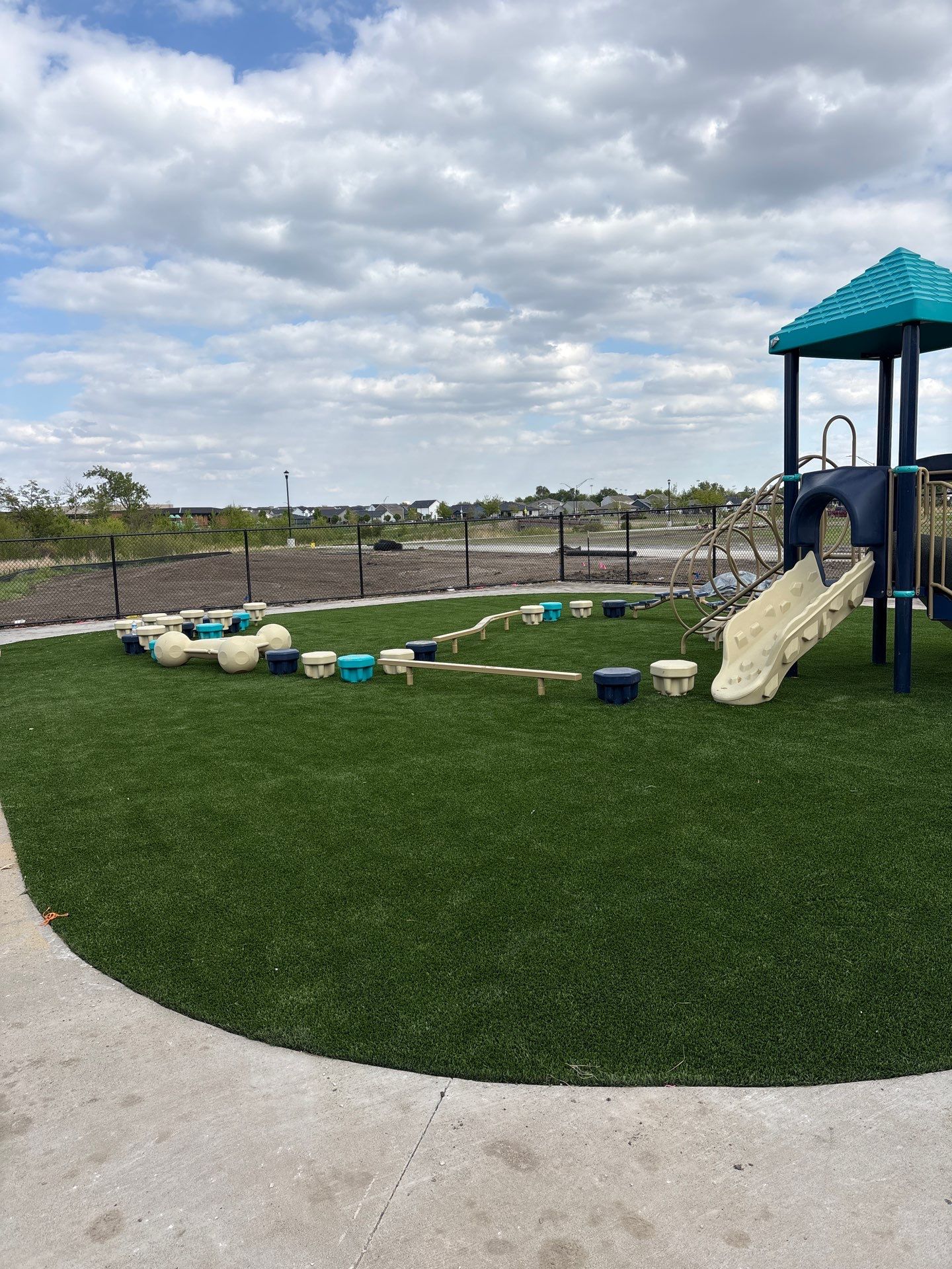 Everbrook in Grimes Playground Equipment & Turf by Southwest Greens Midwest
