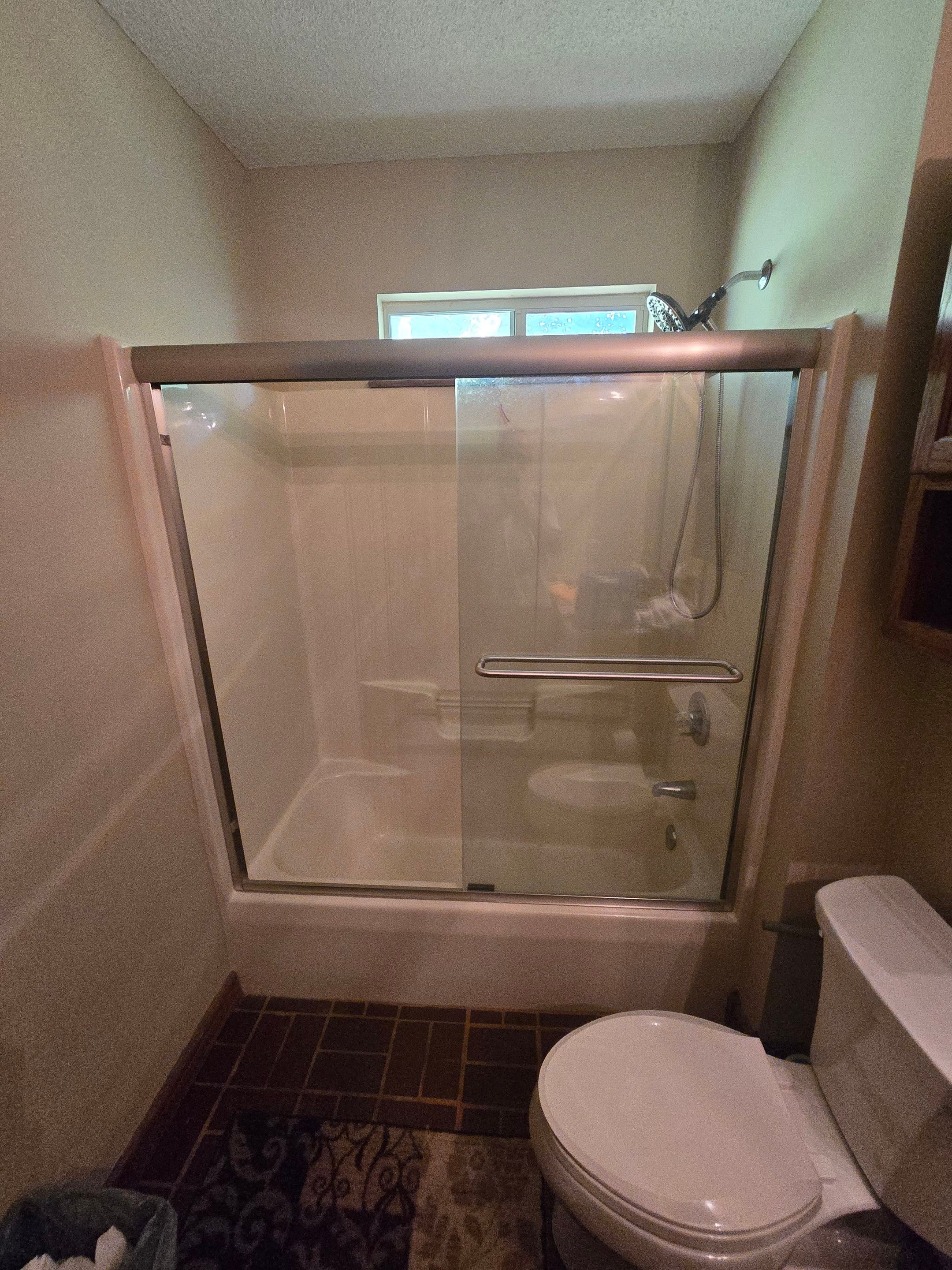 Sentrel Shower with window and ADA chair / ADA grab bar by Academy Construction