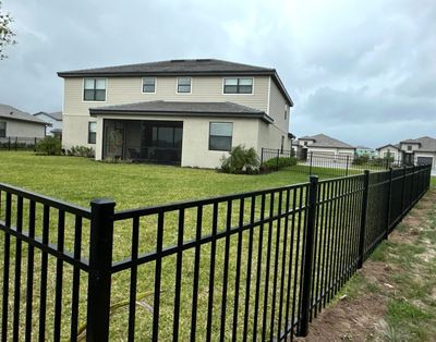 Aluminum Fence Installation using Black 3 Rail Aluminum Fence