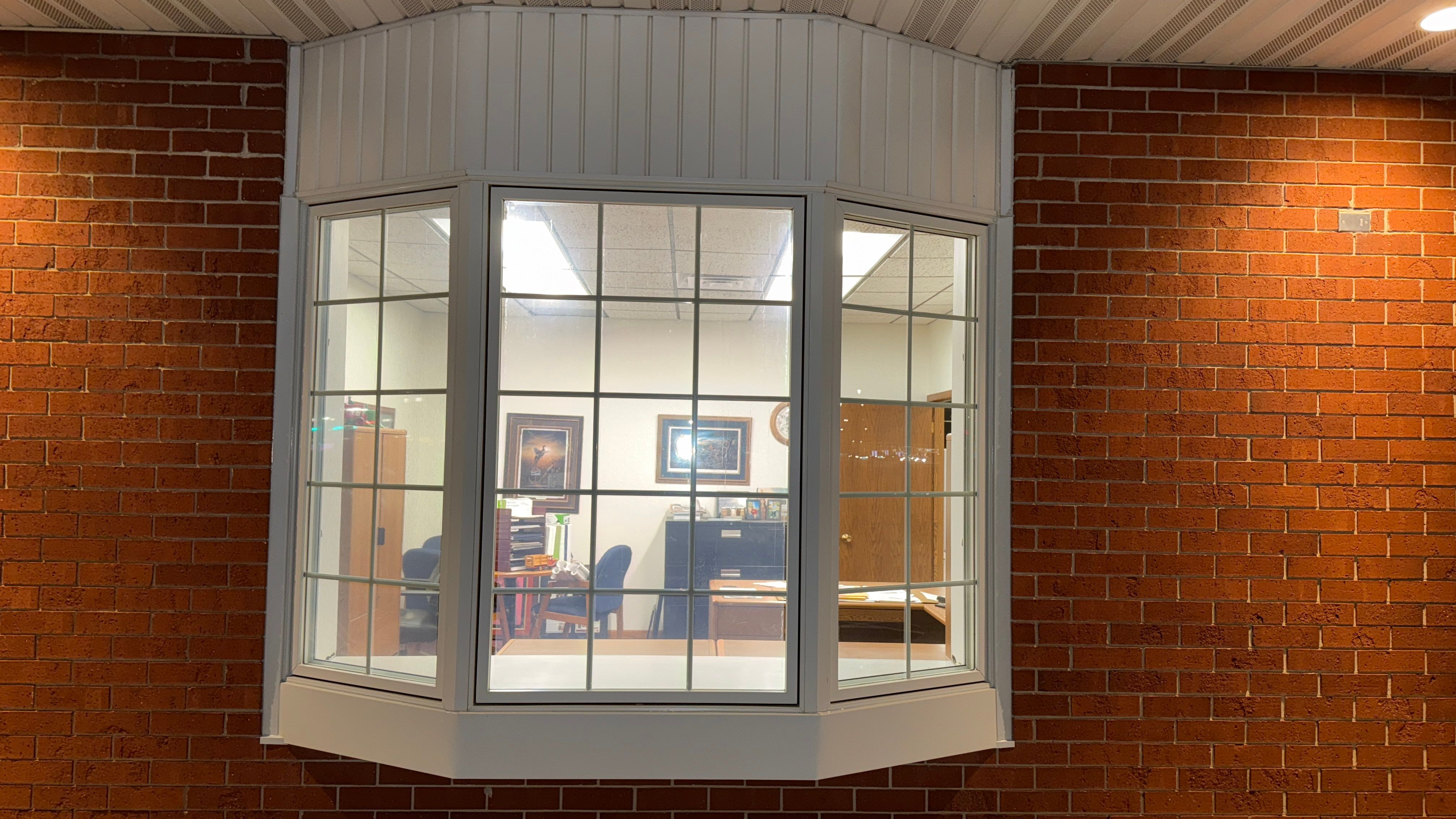 Pella Window installation using Pella Lifestyle wood/Aluminum window by United Windows and Siding LLC