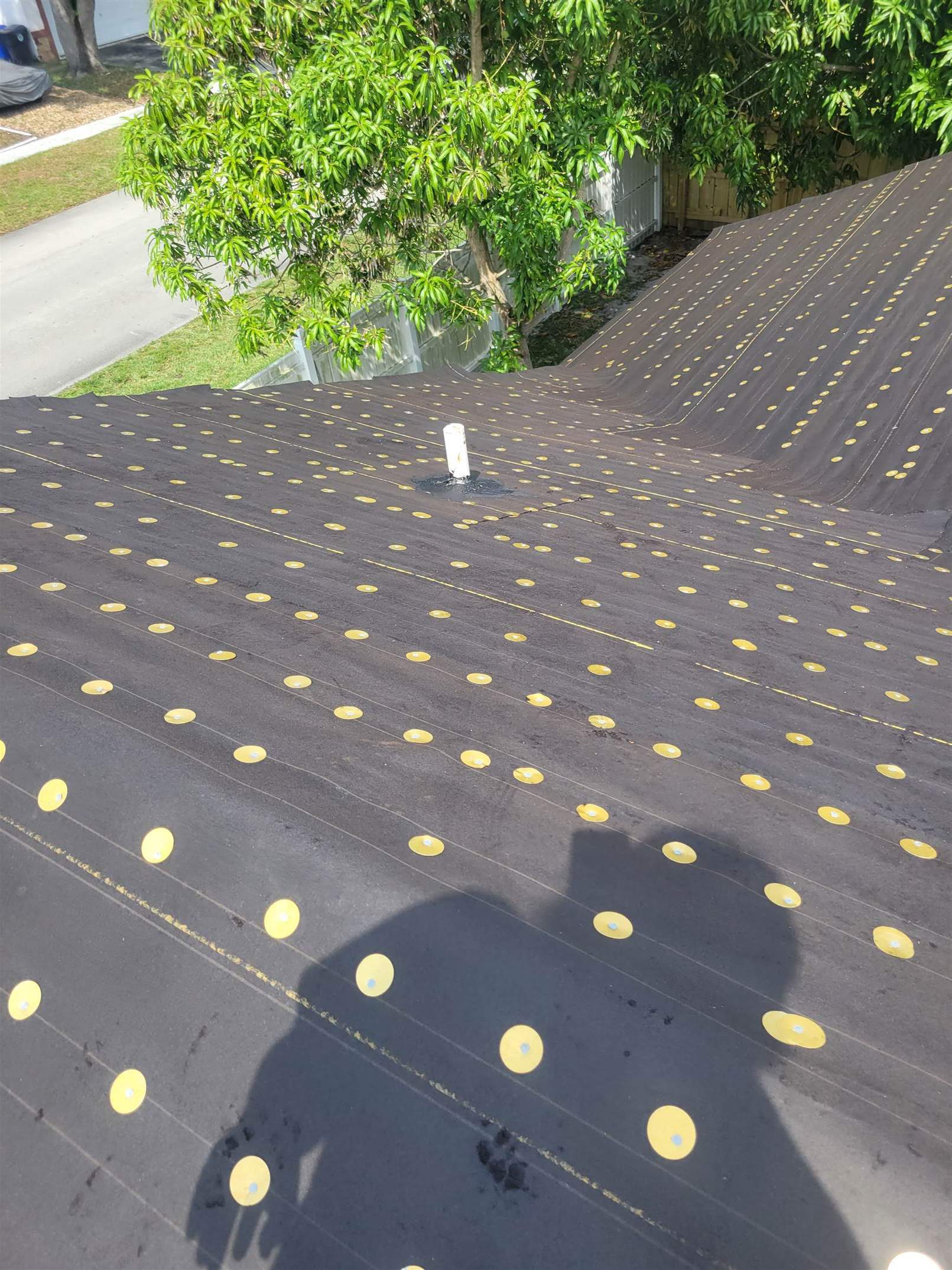 Standing Seam Metal & Flat Re-Roof using 1.5" Nail Strip 24ga Solar White Kynar Coated Standing Seam Metal Panels by Morton Roofing, Inc.