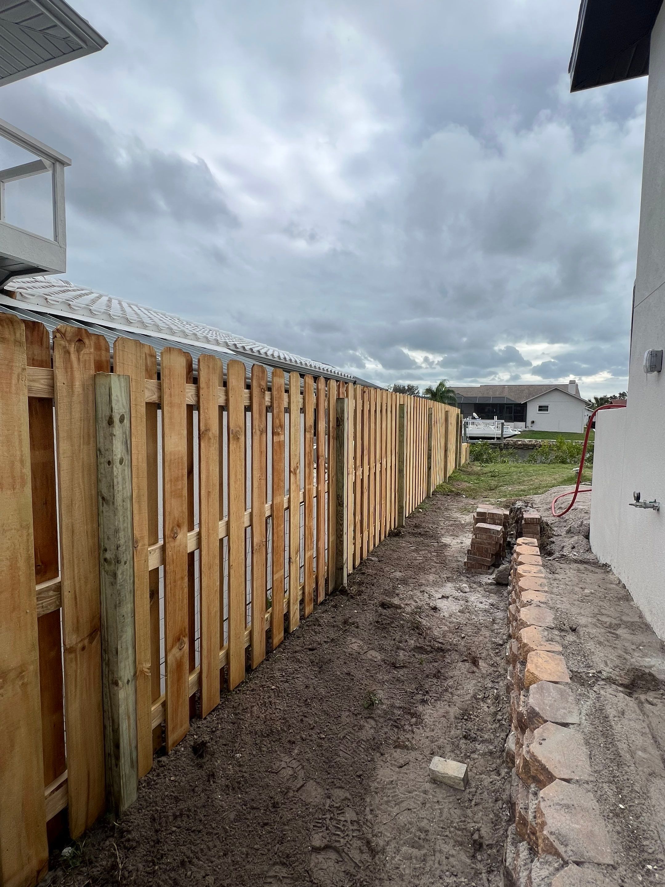 Wood Fence Installation using 6Ft Tall Pressure Treated Wood Shadowbox Fence by Asap fence and gates, LLC