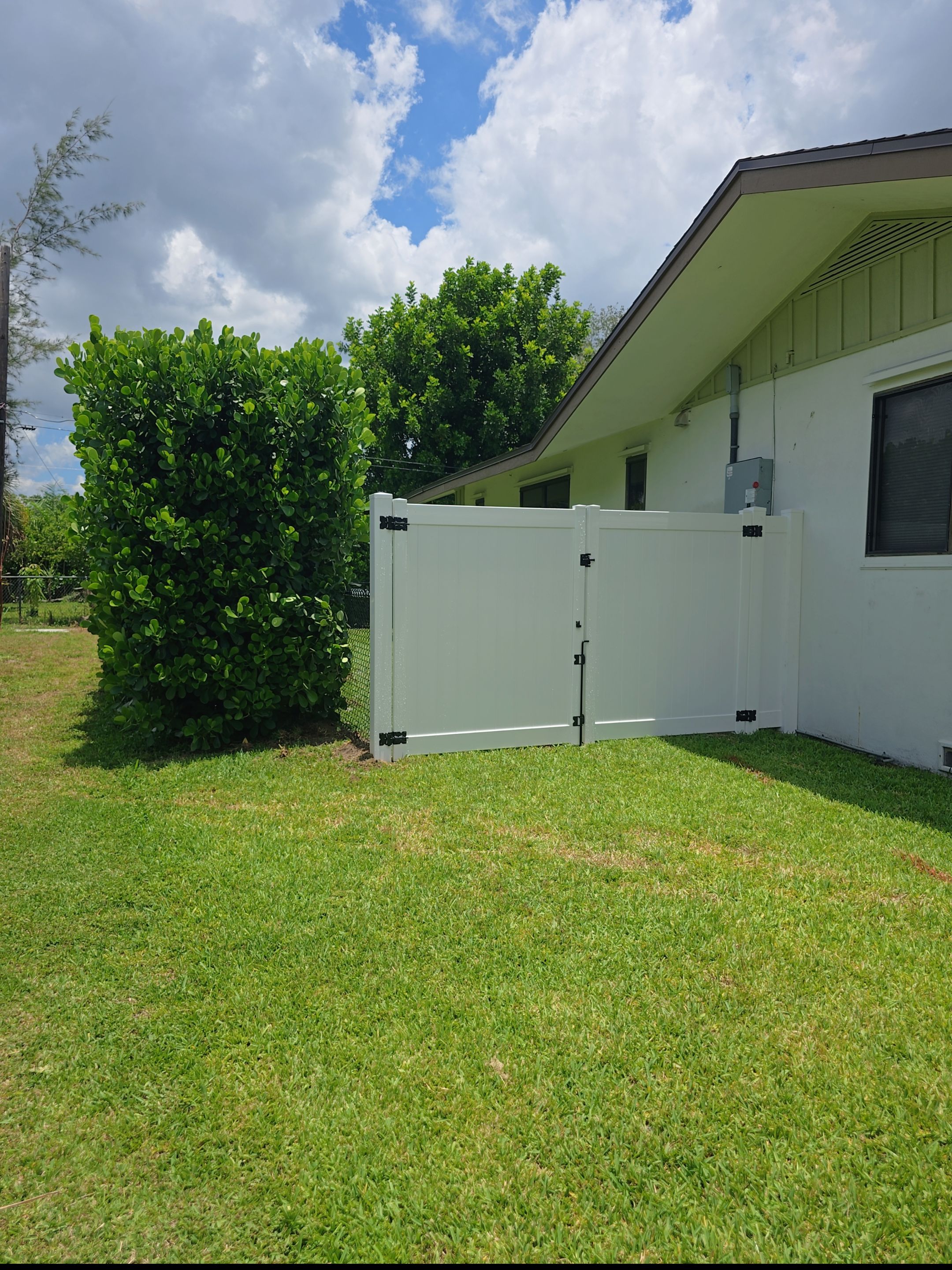 Residential Chain Link Fence Repair and Vinyl Privacy Gate Installation in Naples by True Fence LLC