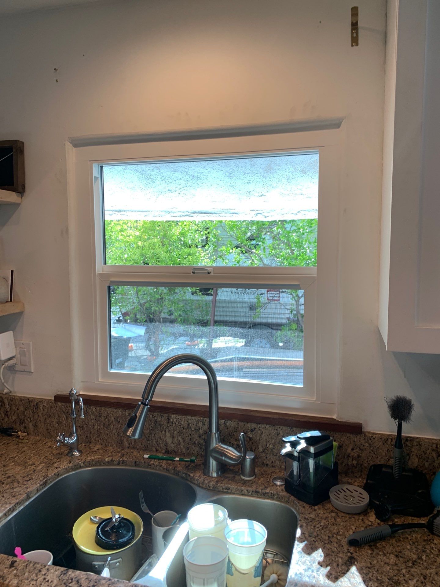 Window Installation using Black Anlin windows by American Window Company