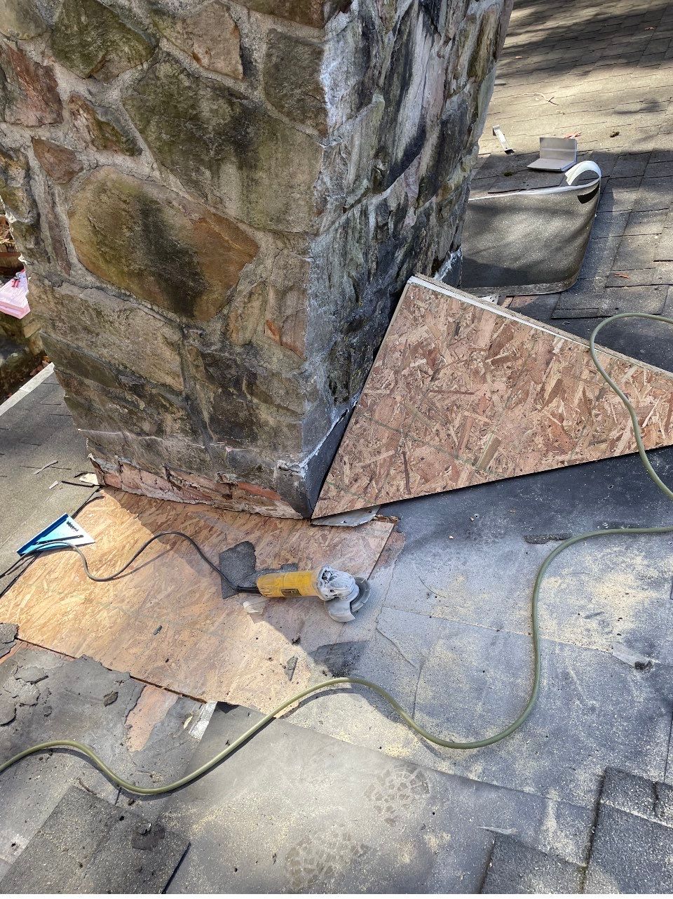 Insurance repair and chimney saddle installation. by Teflon Roofing