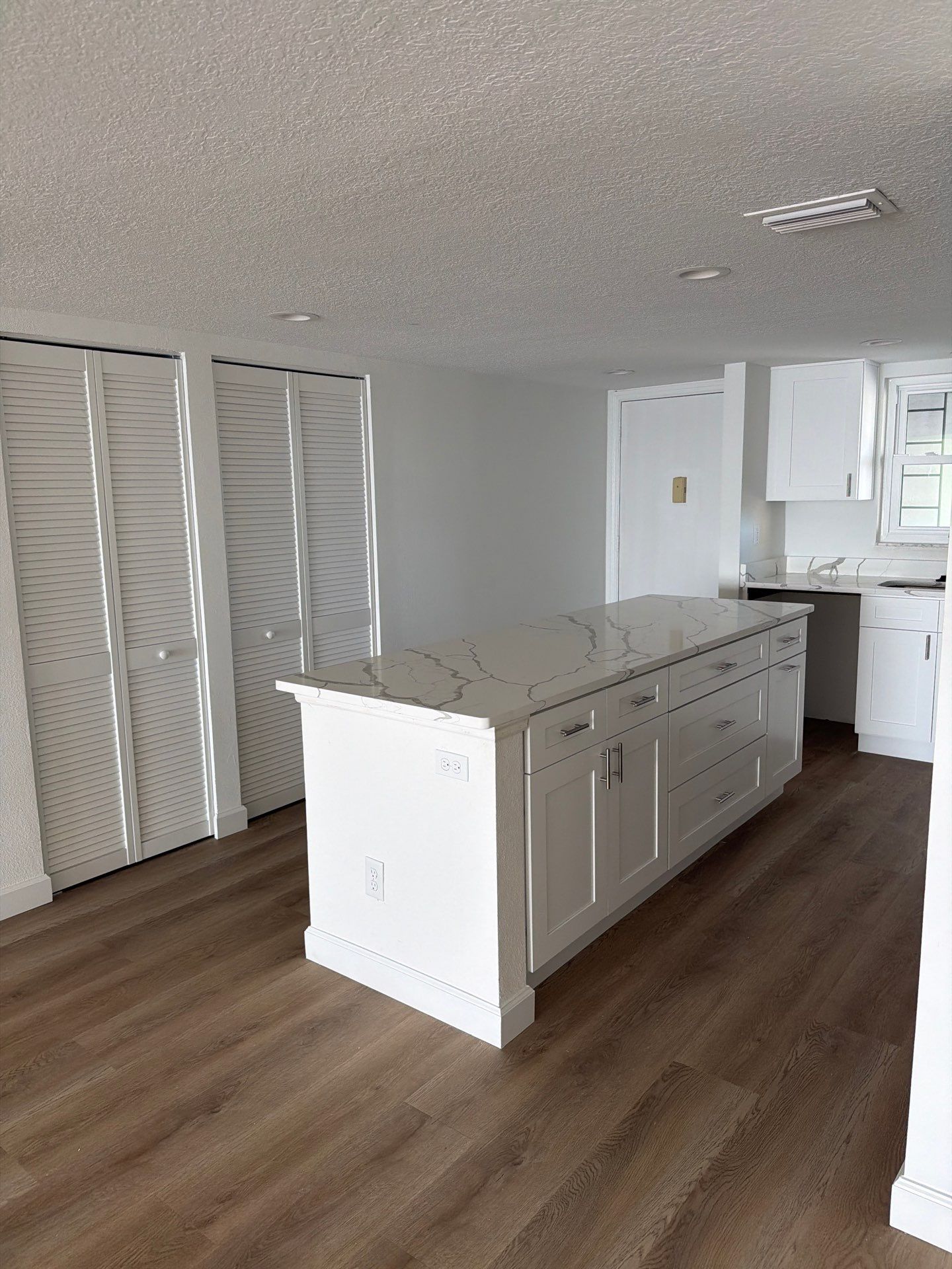 Full Condominium Remodel Featuring Aubrey Oak Flooring In Daytona Beach by Acies Renovations