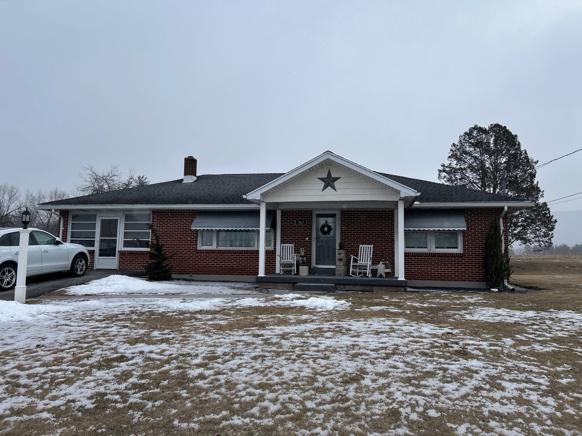 Tower City Residential Addition Featuring Gray Vinyl Siding and Garage by Esh Builders