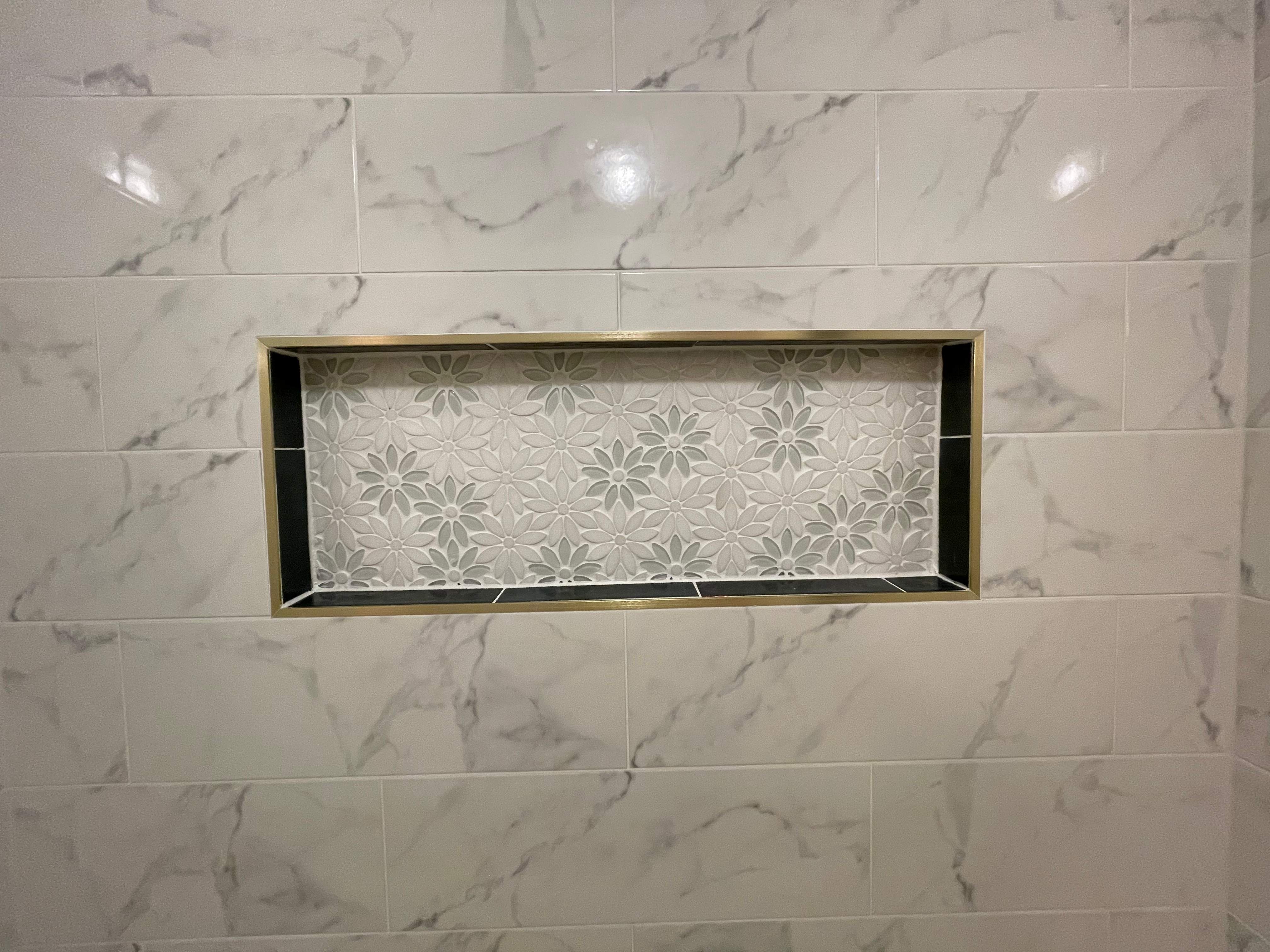 Tub retile, floor, vanities, mirror, and lights by Prudencio