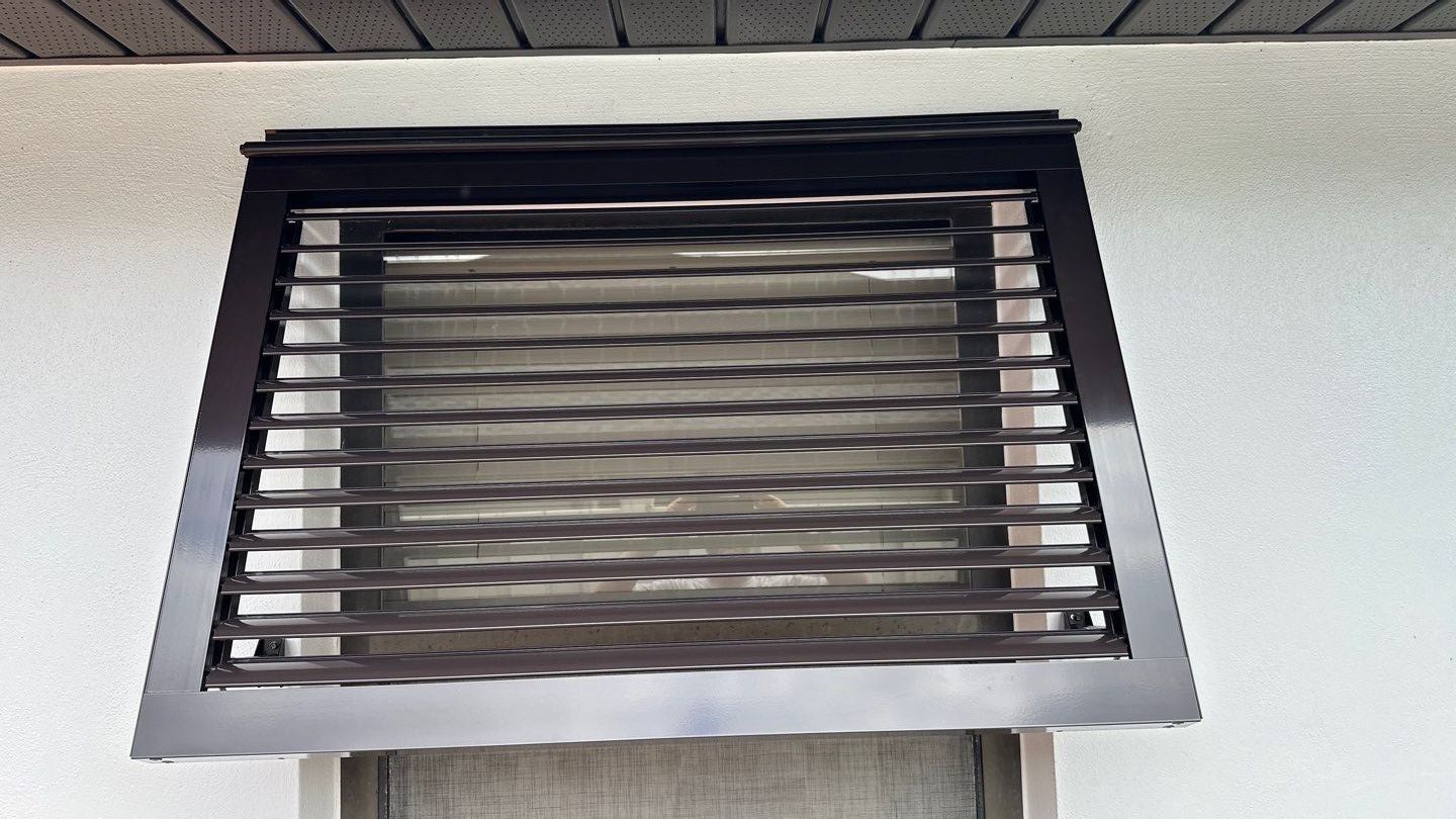 Bahama Shutters in Grey Brown by Smart Guard Shutters