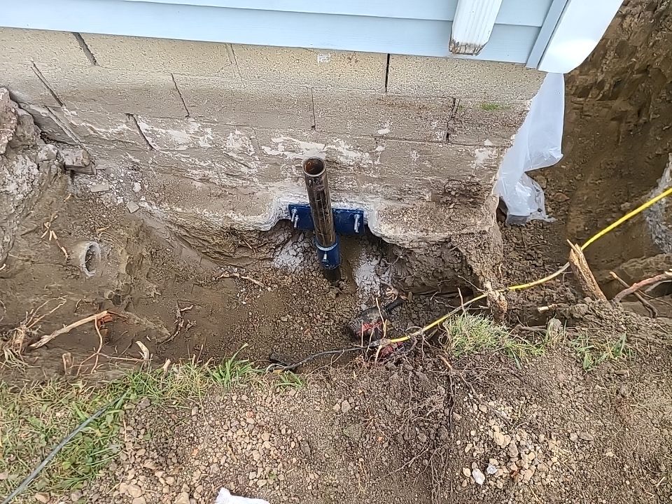 Lifting Home With Piers using Magnum Piers by Toledo Basement Repair