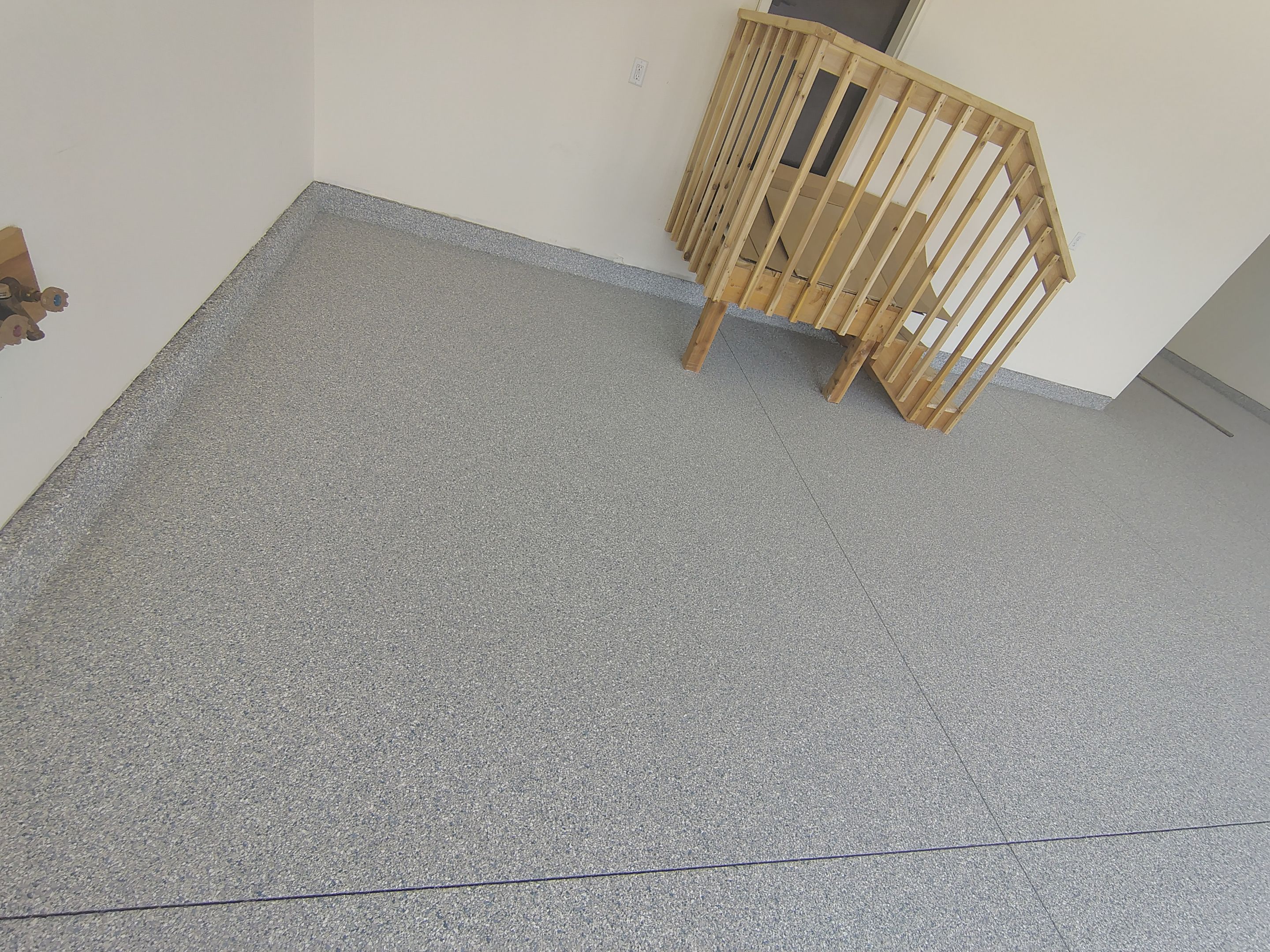 Sioux Falls Garage Floor Transformation with Gray Decorative Flake Coating by Select Painting, Coatings & Garage Cabinets