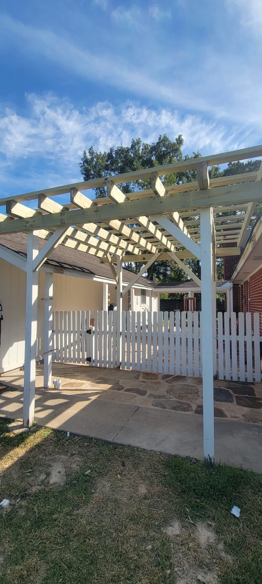 🌿 Rodney – Full Gutters, Drainage System, Flagstone Patio & Pergola  Alejandro and the Texas Urban Elements Team recently completed a multi-solution project for Rodney’s home, blending function with design.  ✅ Seamless Gutters We installed a complete 6” seamless gutter system around the home to properly redirect rainwater away from the foundation, protecting siding, paint, and landscaping while boosting curb appeal.  ✅ Drainage System A new PVC storm drainage system was integrated into the gutters and extended to carry roof runoff away from the house. This ensures water won’t pool near the foundation or the new patio area.  ✅ Flagstone Patio Ground We prepped, leveled, and installed a custom flagstone patio for Rodney—delivering both beauty and durability, creating a natural, timeless look that ties perfectly into the yard.  ✅ Pergola Addition To conclude, our framing team constructed a small pergola extension, providing Rodney’s patio with a shaded retreat for family and friends to enjoy.  ✨ Result: A fully protected and enhanced outdoor living space where drainage, stonework, and structure all work together for long-lasting performance and comfort.  📢 At Texas Urban Elements, we specialize in building solutions that protect homes while creating beautiful outdoor environments. by Texas Urban Elements