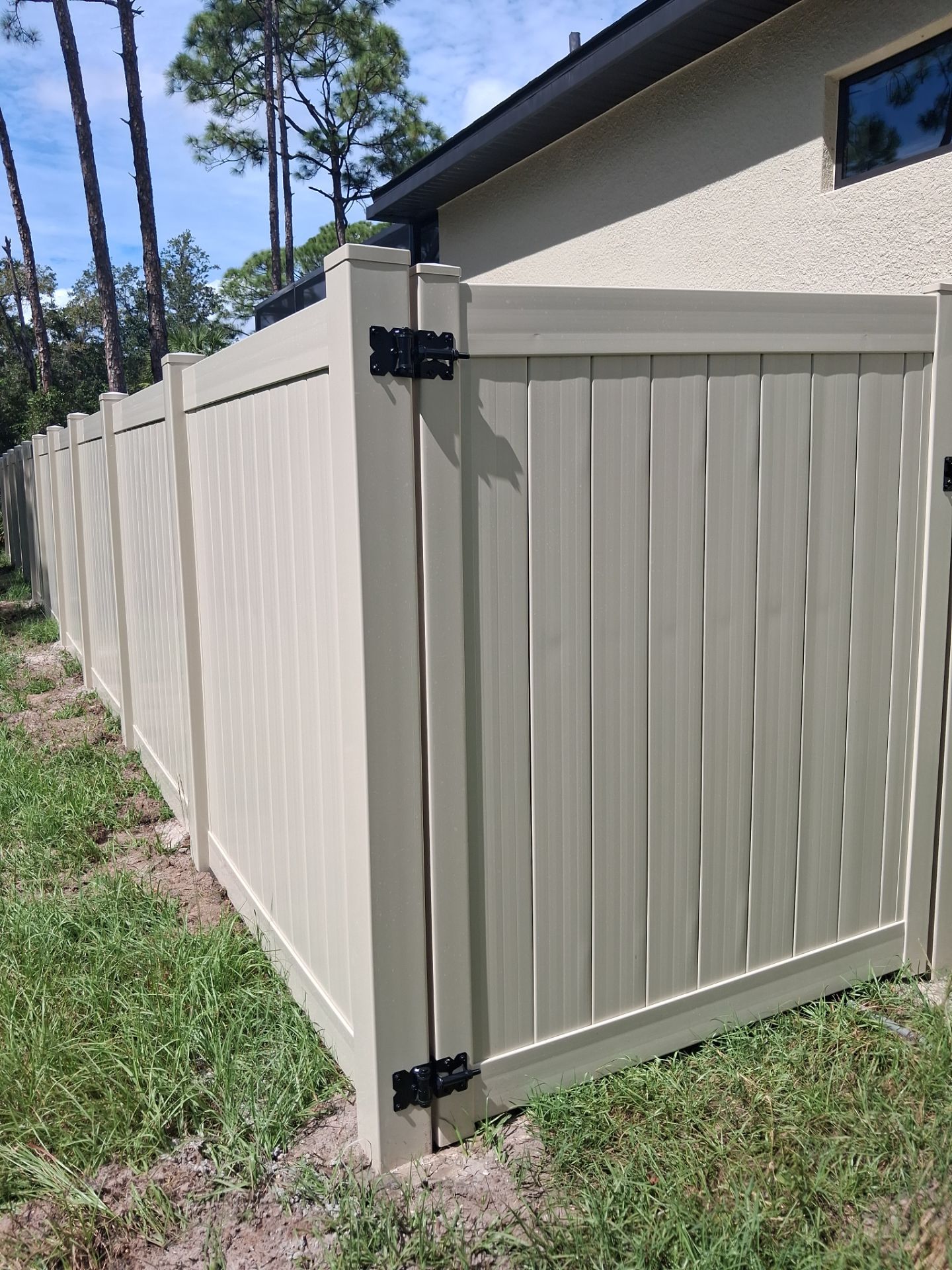 Tan Vinyl Privacy Fence and Gate Installation in Port Charlotte by True Fence LLC