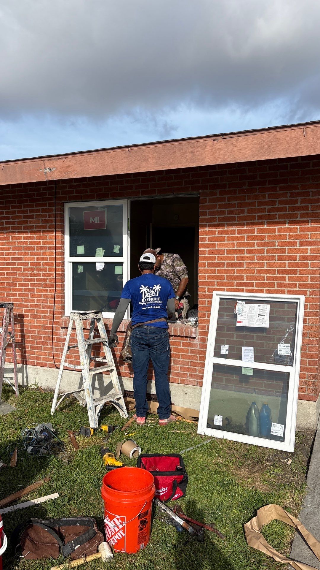 Installing Windows on a Submarine  by Bayfront Roofing and Construction