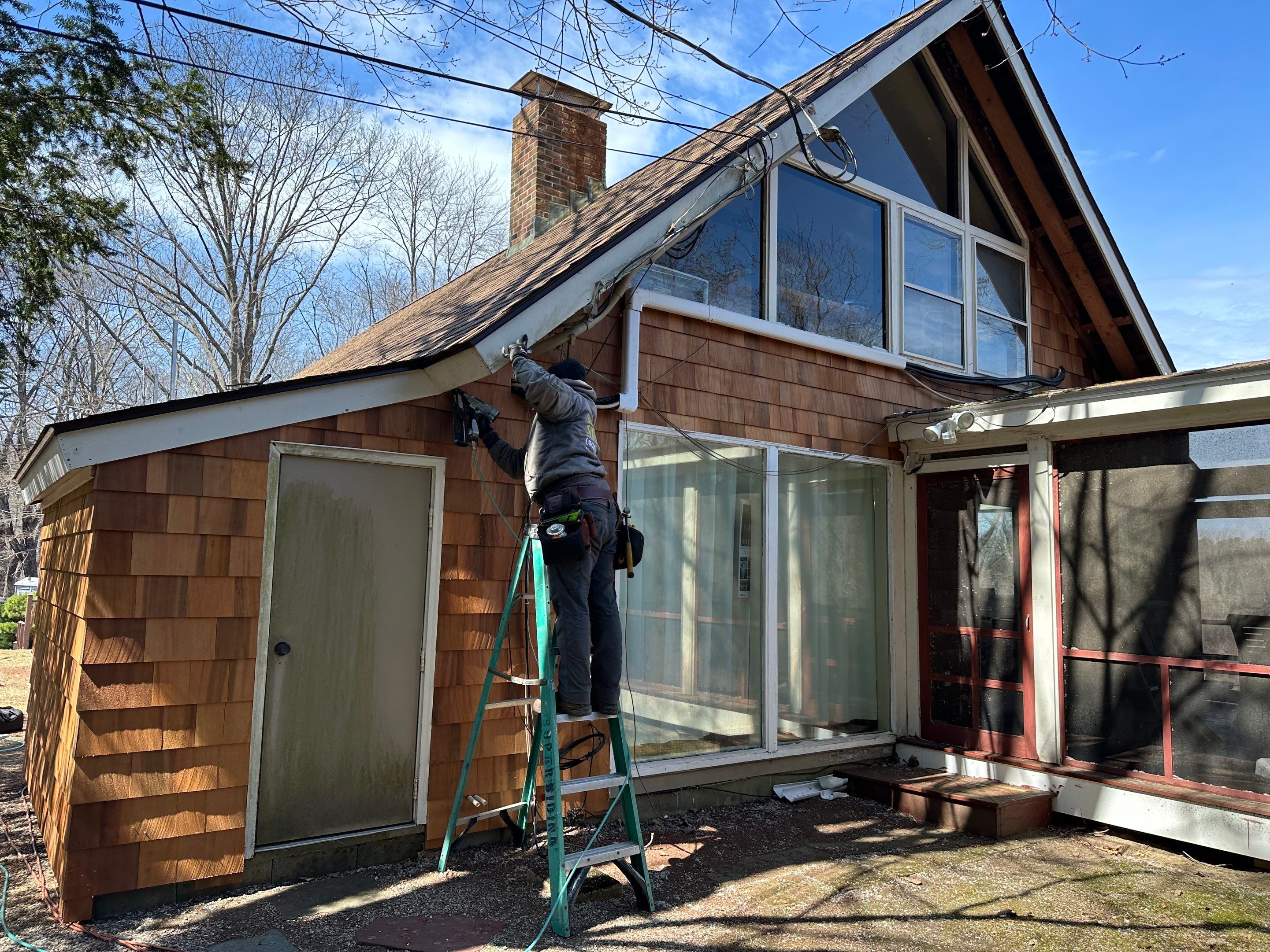 Siding Installation using Perfection Red Western Cedar Shingles  by Loyalty Exterior Solutions 