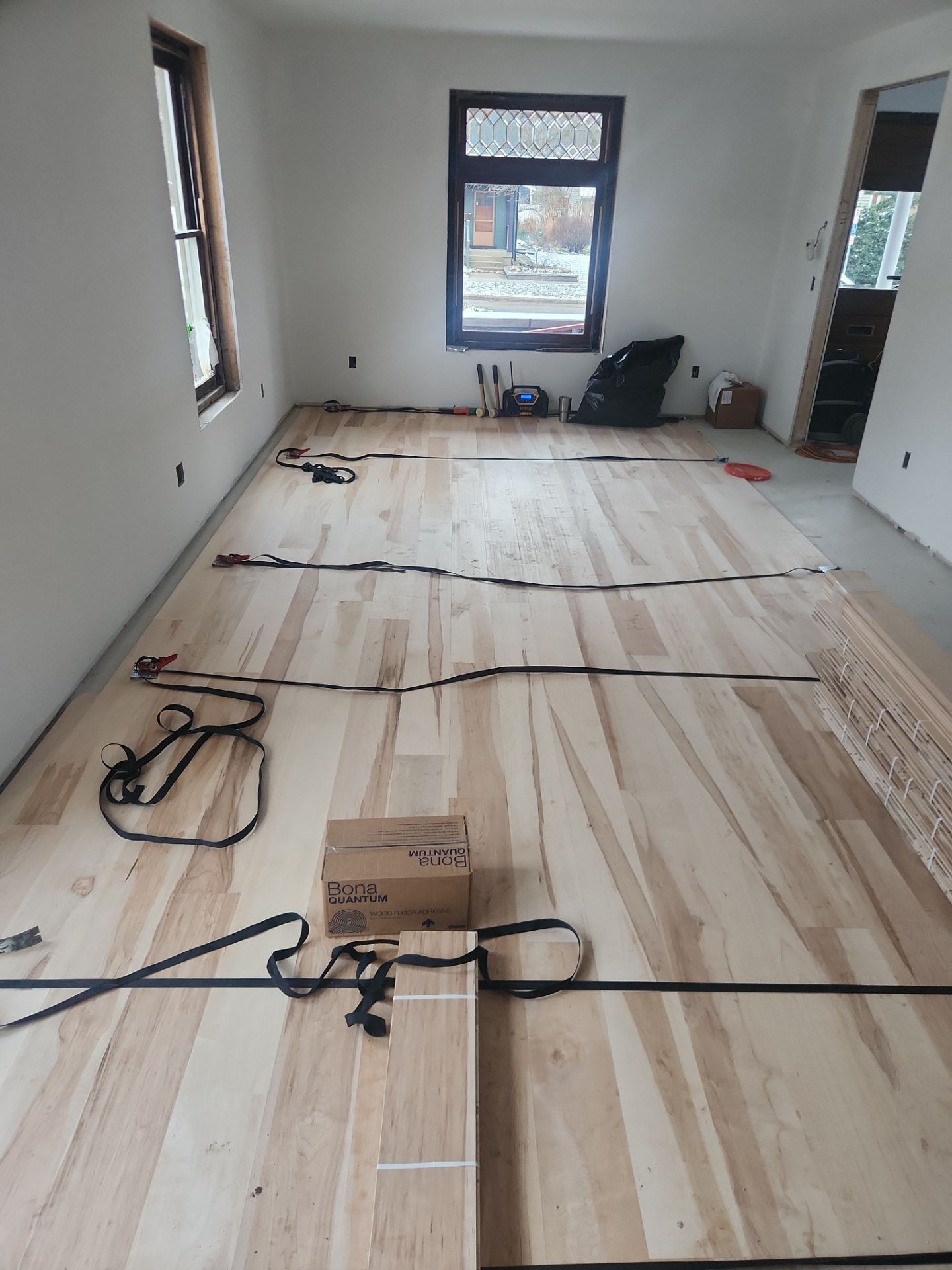 Full glue down Installation over radiant heat 7" Maple character grade by Ann Arbor Hardwoods 