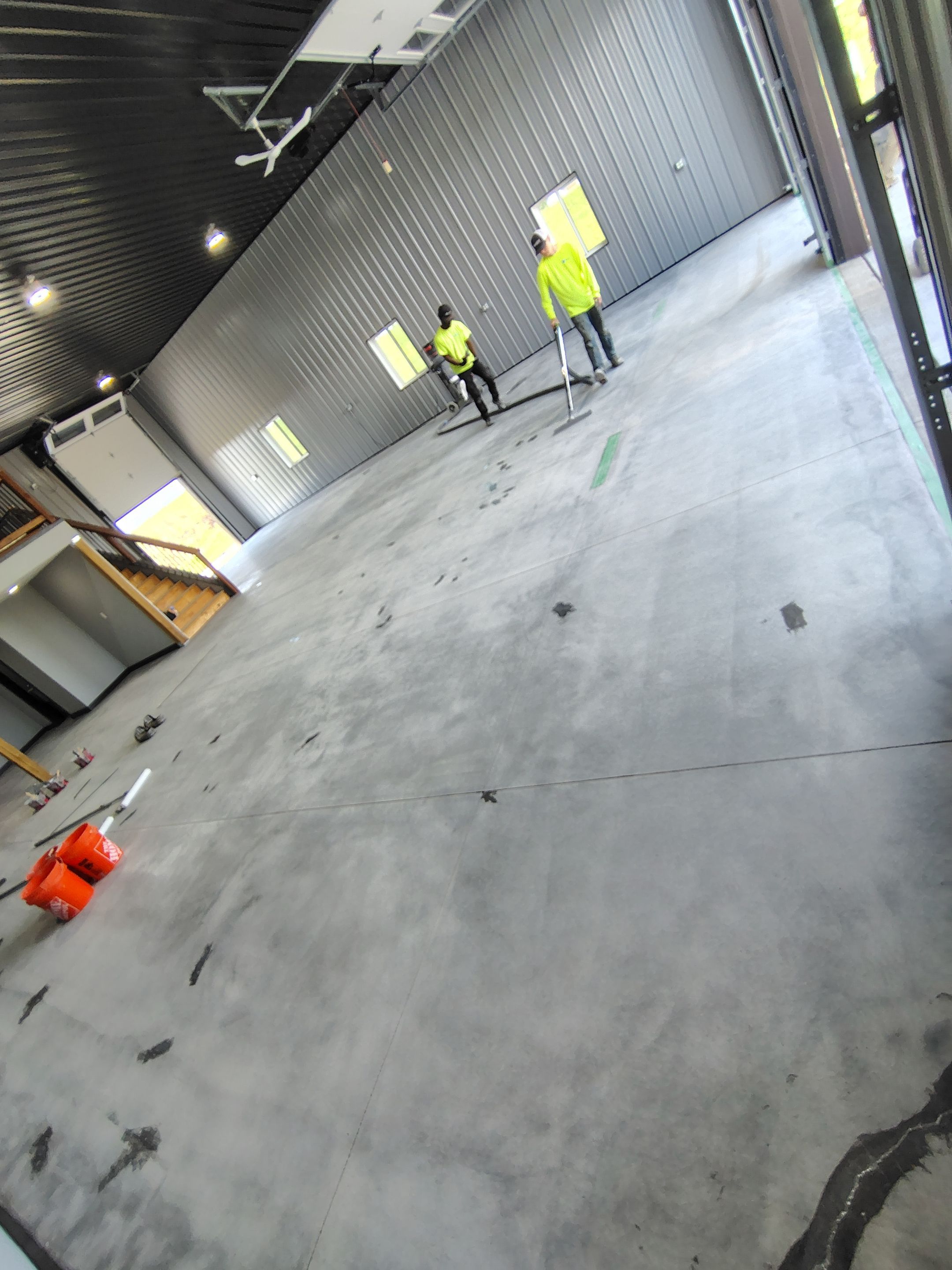 Polyaspartic Garage Floor Coating with Decorative Flake in Wentworth by Select Painting, Coatings & Garage Cabinets