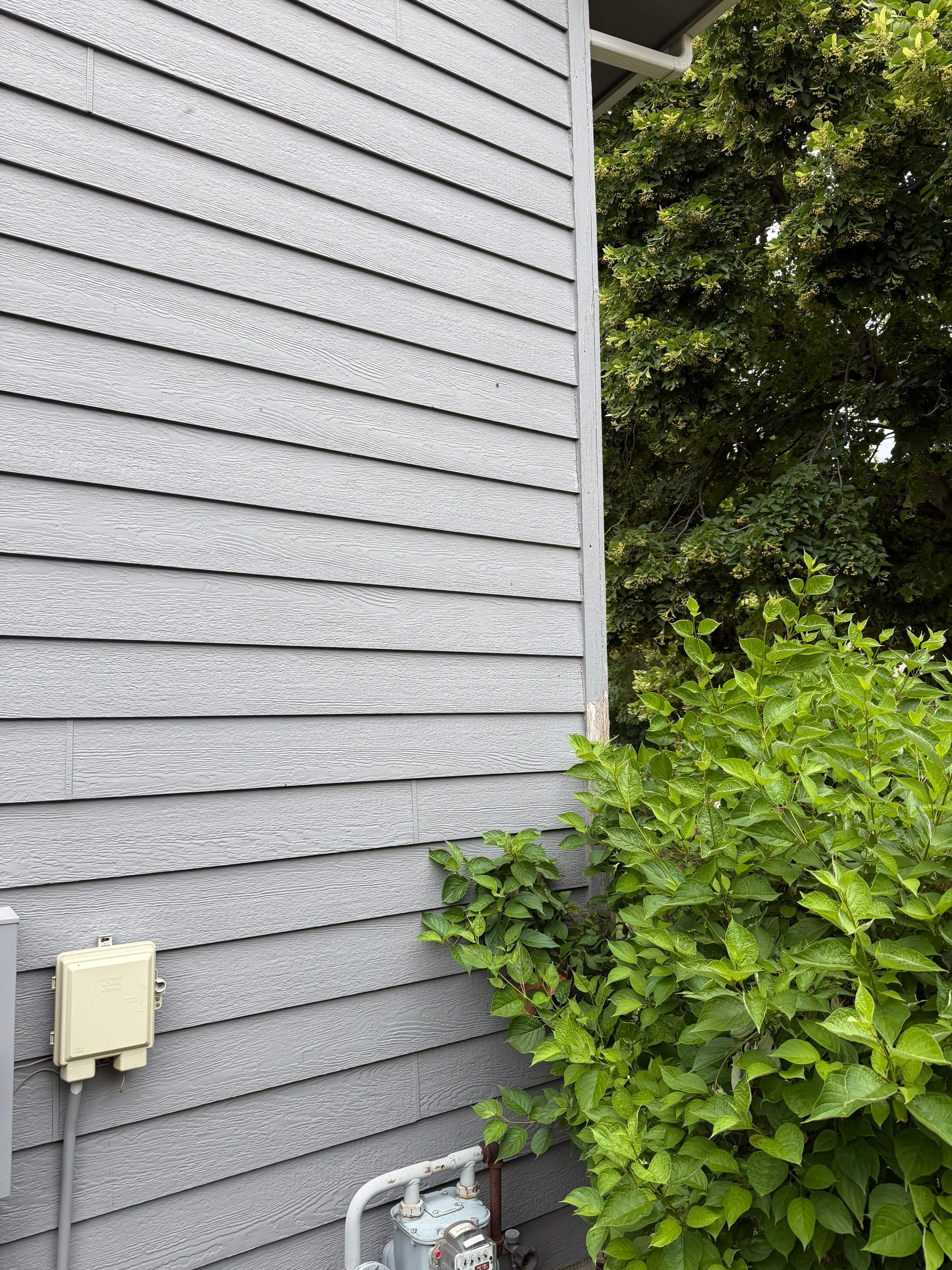 Full Exterior Painting for Gray Siding and Trim in Sioux Falls by Select Painting, Coatings & Garage Cabinets
