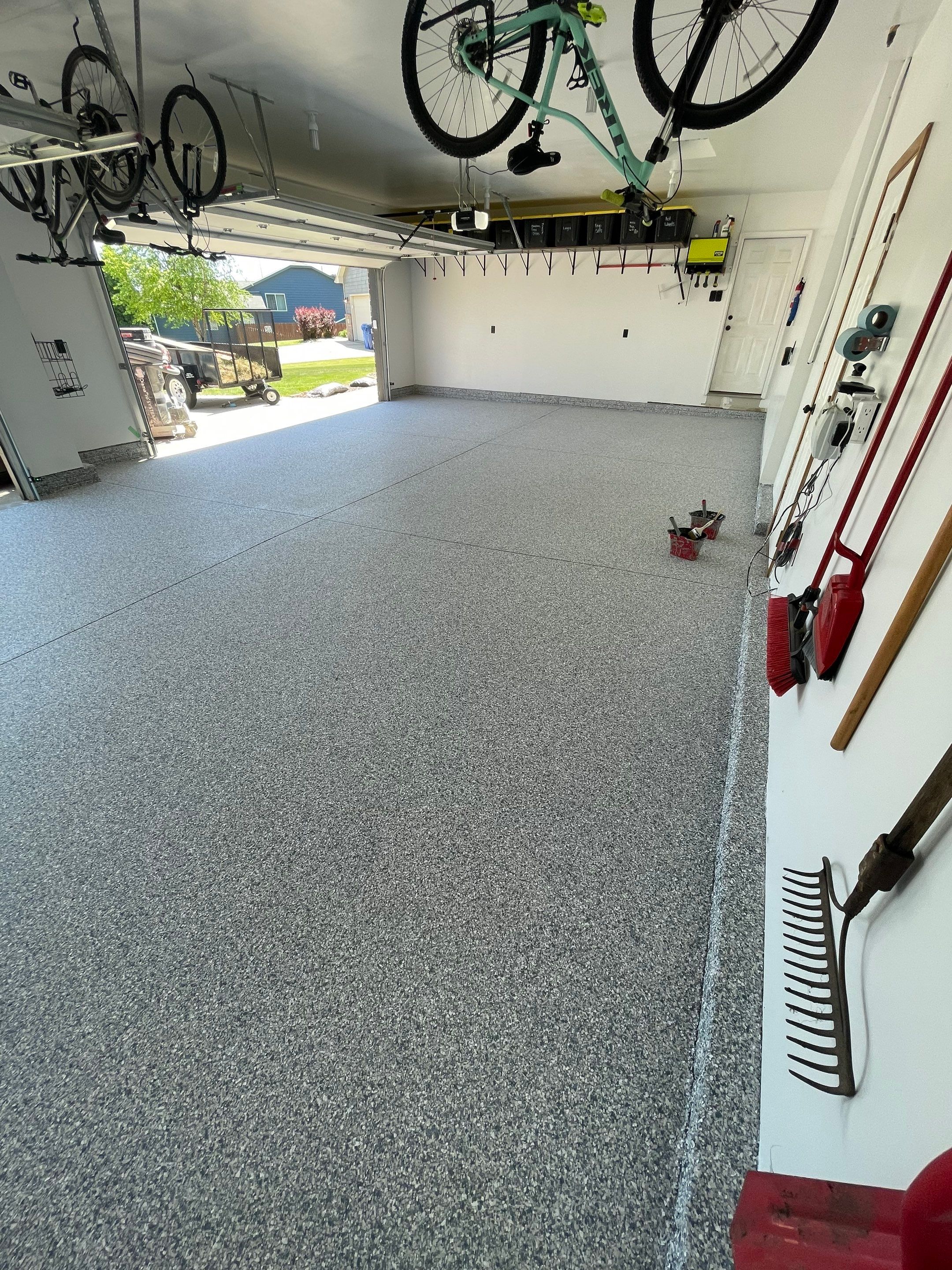 Tidal Wave Flake Garage Floor Installation in Sioux Falls by Select Painting, Coatings & Garage Cabinets