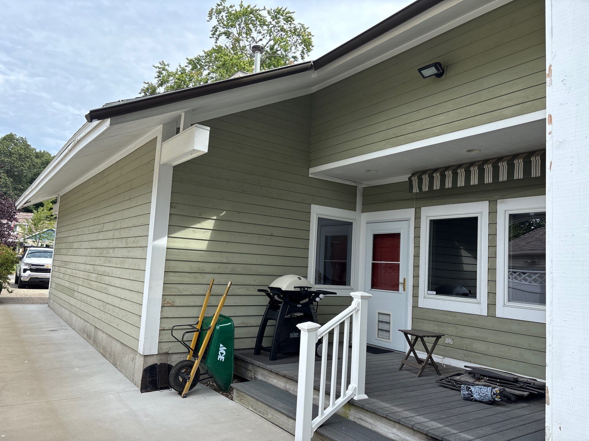 Full Exterior Painting and Trim Restoration for Muskegon Residence by Gordon Painting
